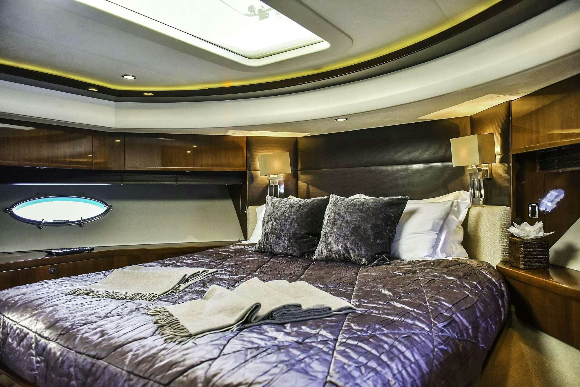 a bed with pillows aboard AGAVE Yacht for Charter