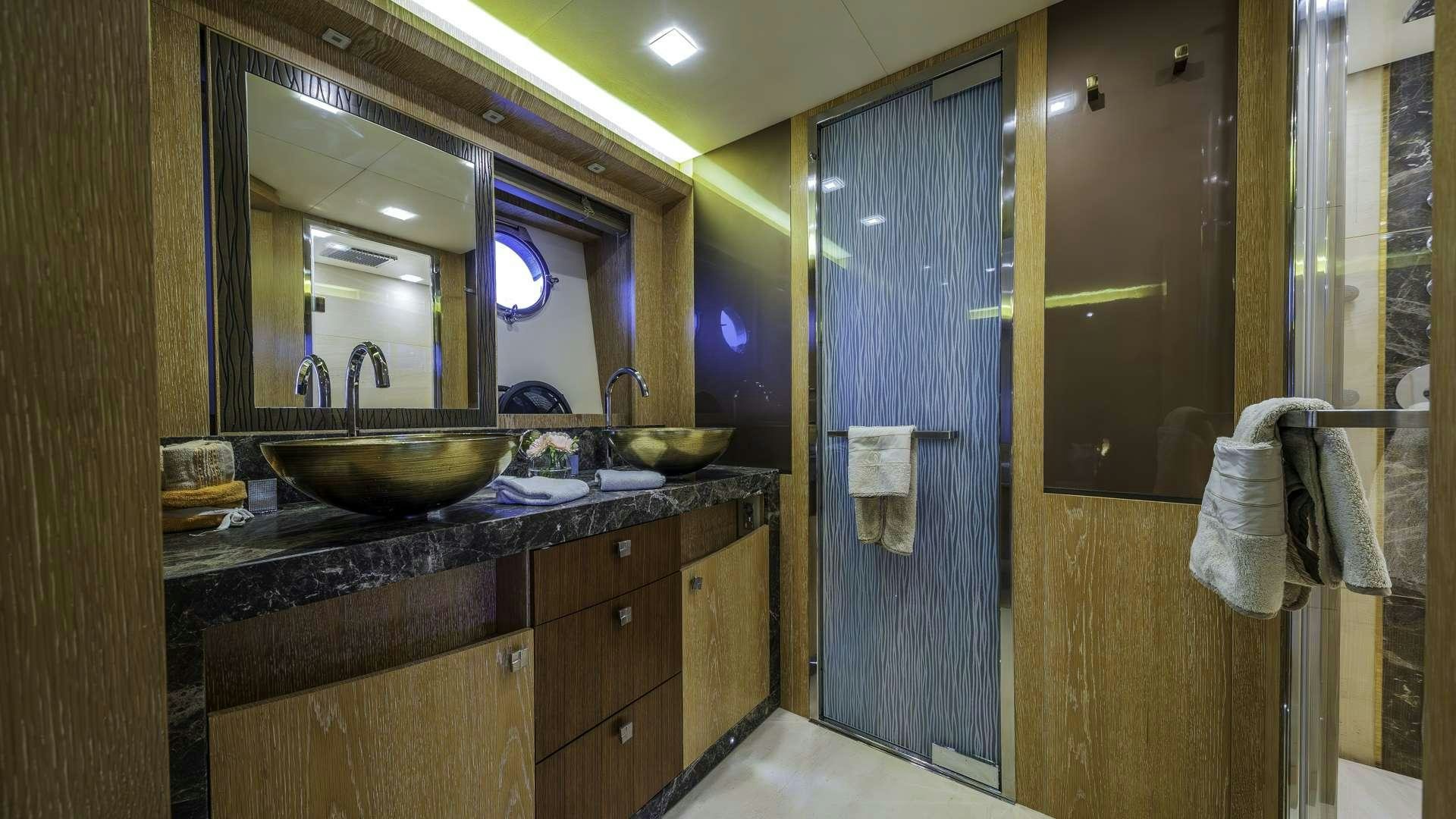 a bathroom with a sink and a mirror aboard GIORGIO Yacht for Charter