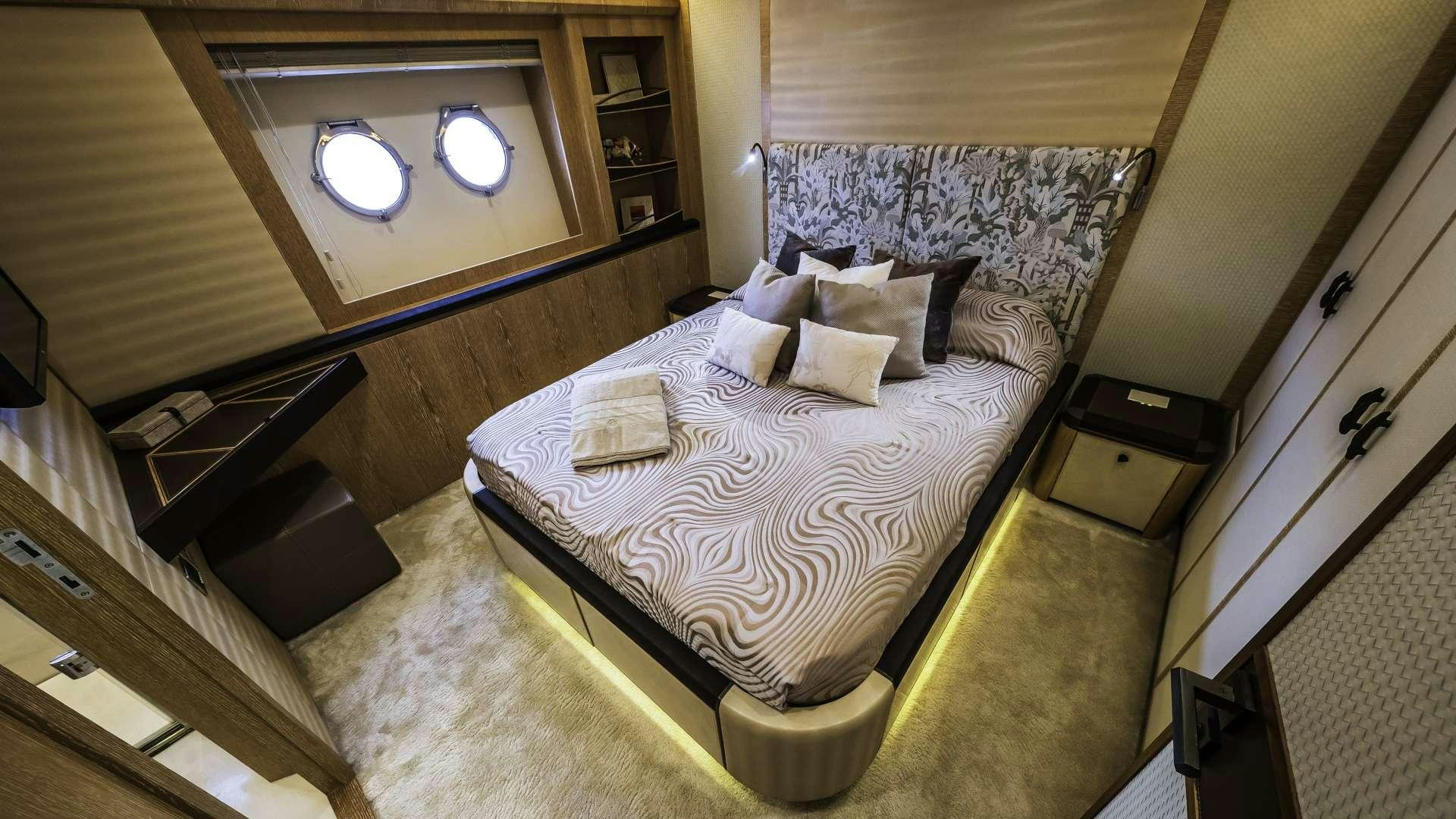 a bed with a white sheet aboard GIORGIO Yacht for Charter