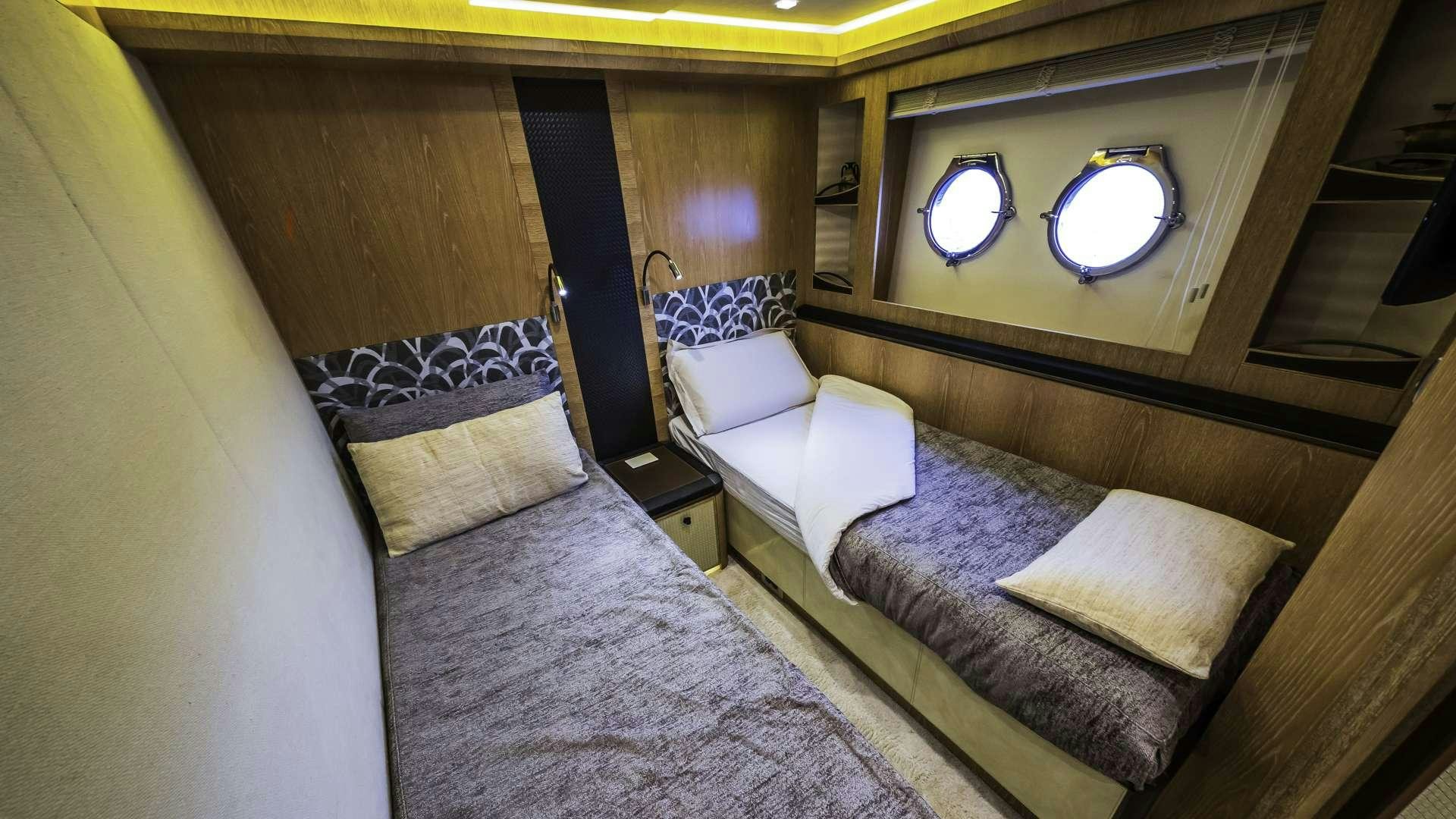 a room with a bed and a mirror aboard GIORGIO Yacht for Charter
