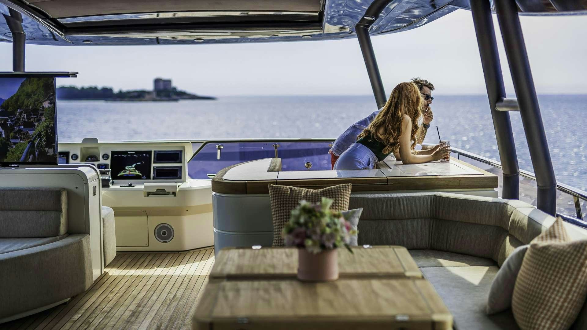 a person sitting on a couch aboard GIORGIO Yacht for Charter