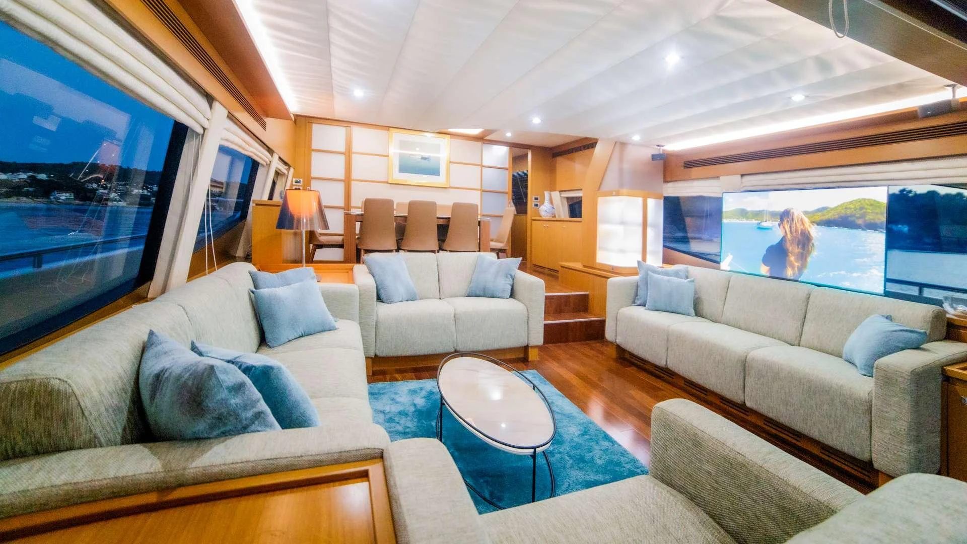 a living room with a large screen aboard ORLANDO L Yacht for Charter