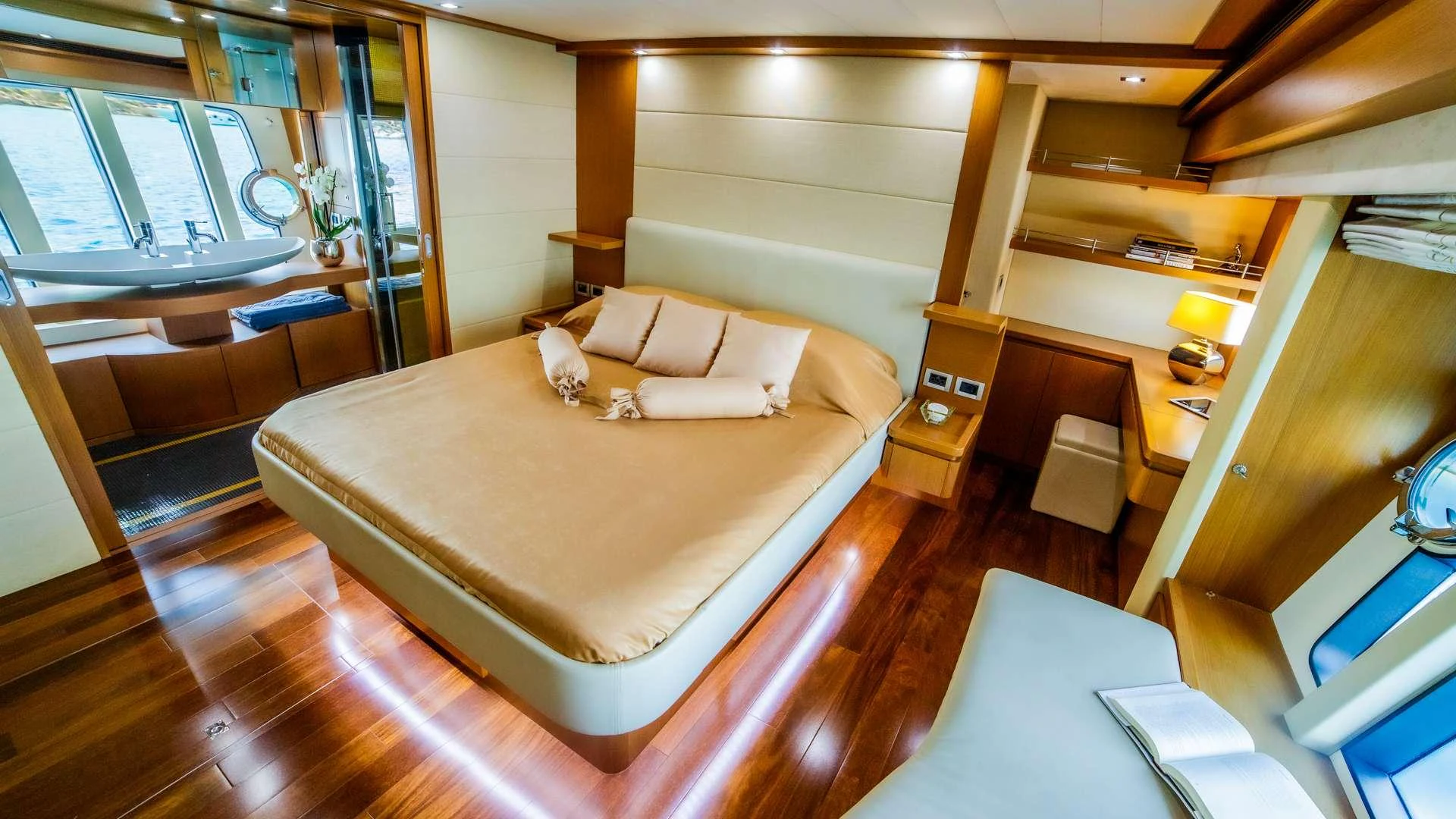 a room with a bed and a desk aboard ORLANDO L Yacht for Charter