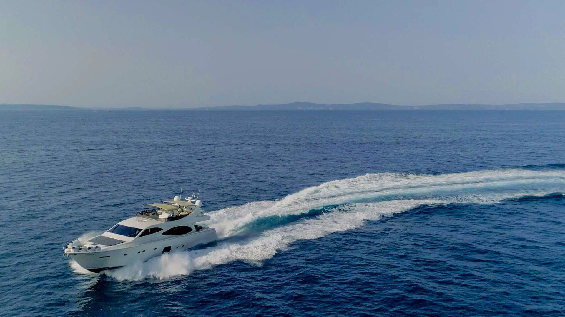 a white yacht in the water aboard ORLANDO L Yacht for Charter