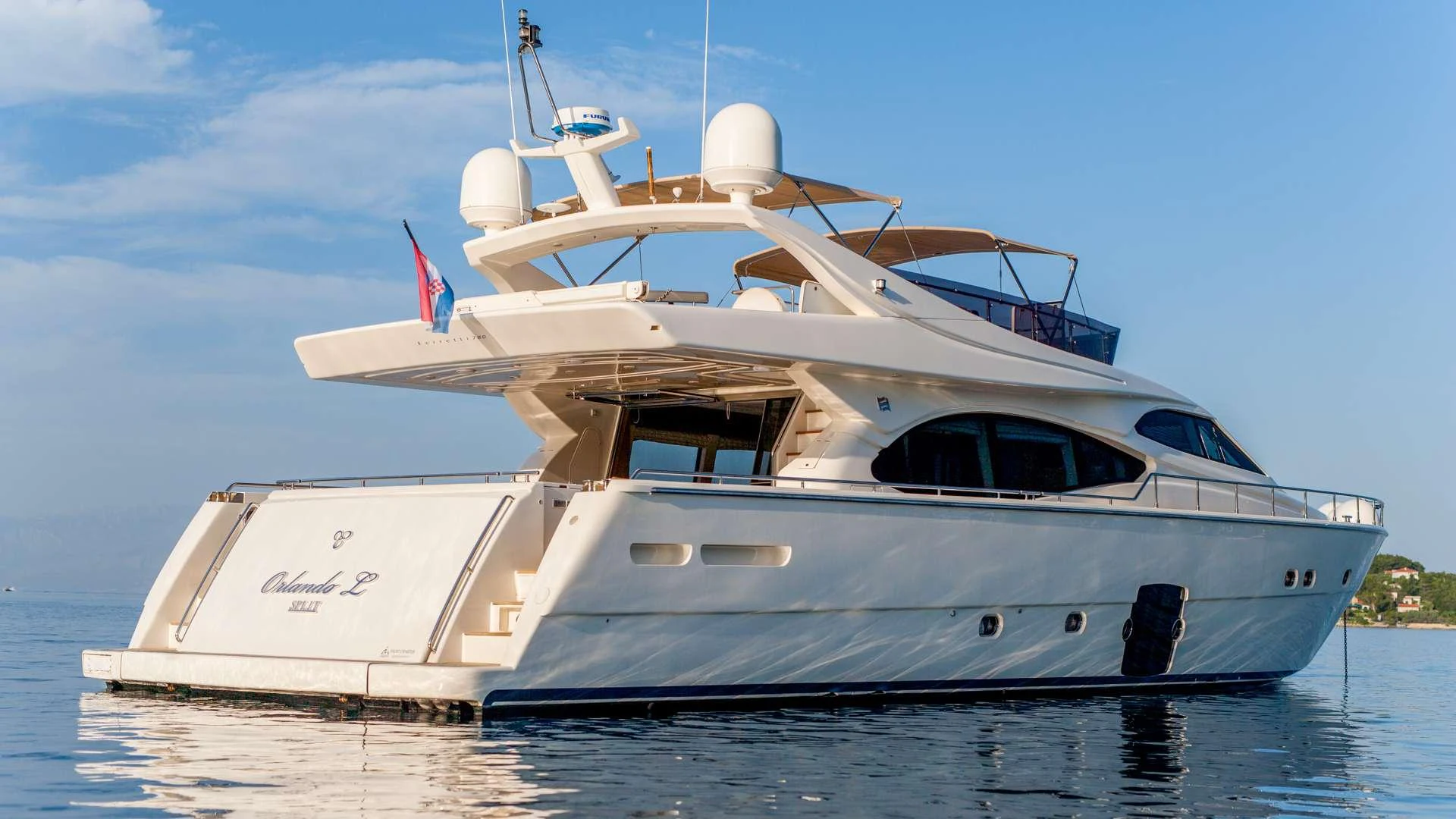 a white yacht on the water aboard ORLANDO L Yacht for Charter