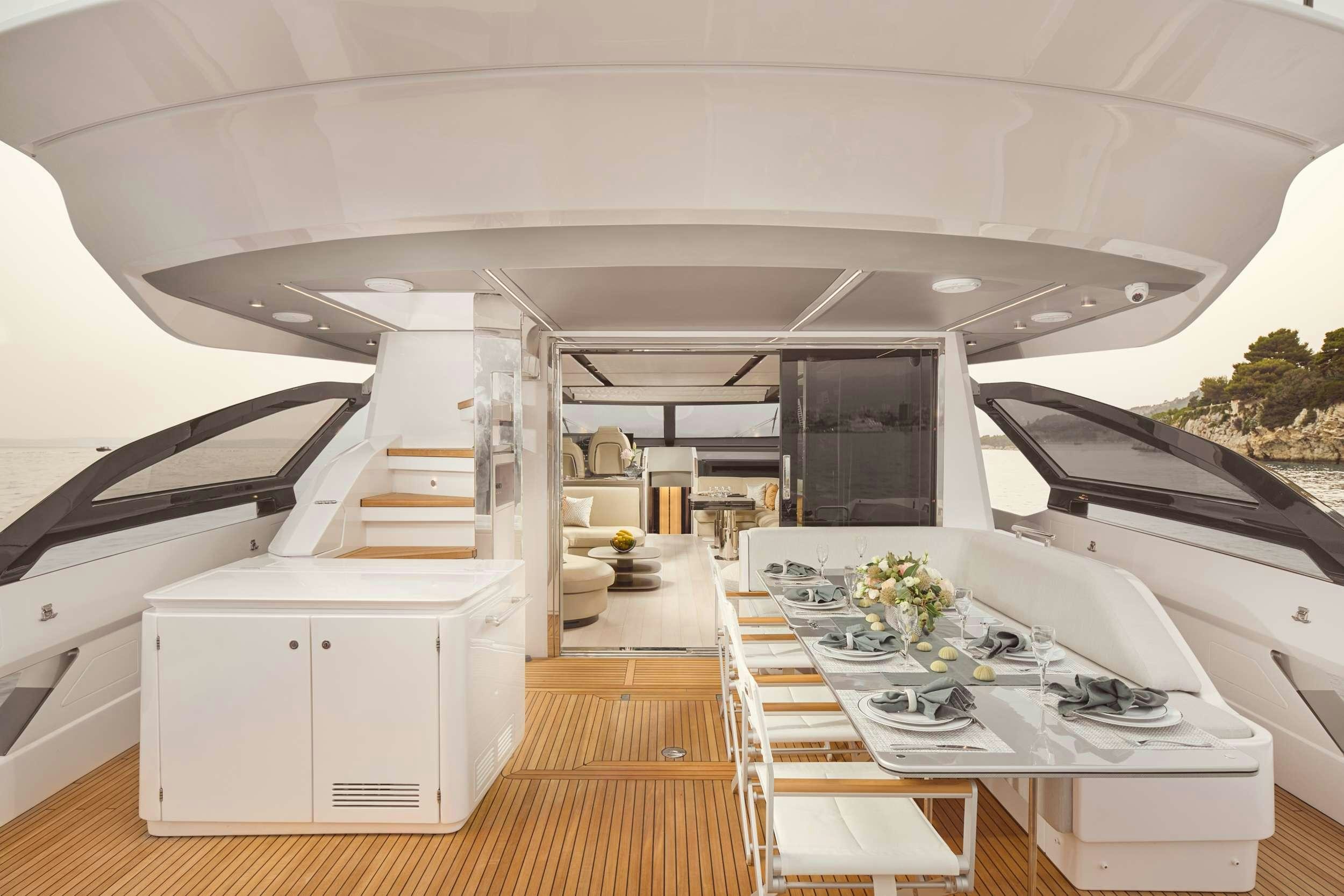 a room with a table and chairs aboard MYNE Yacht for Charter