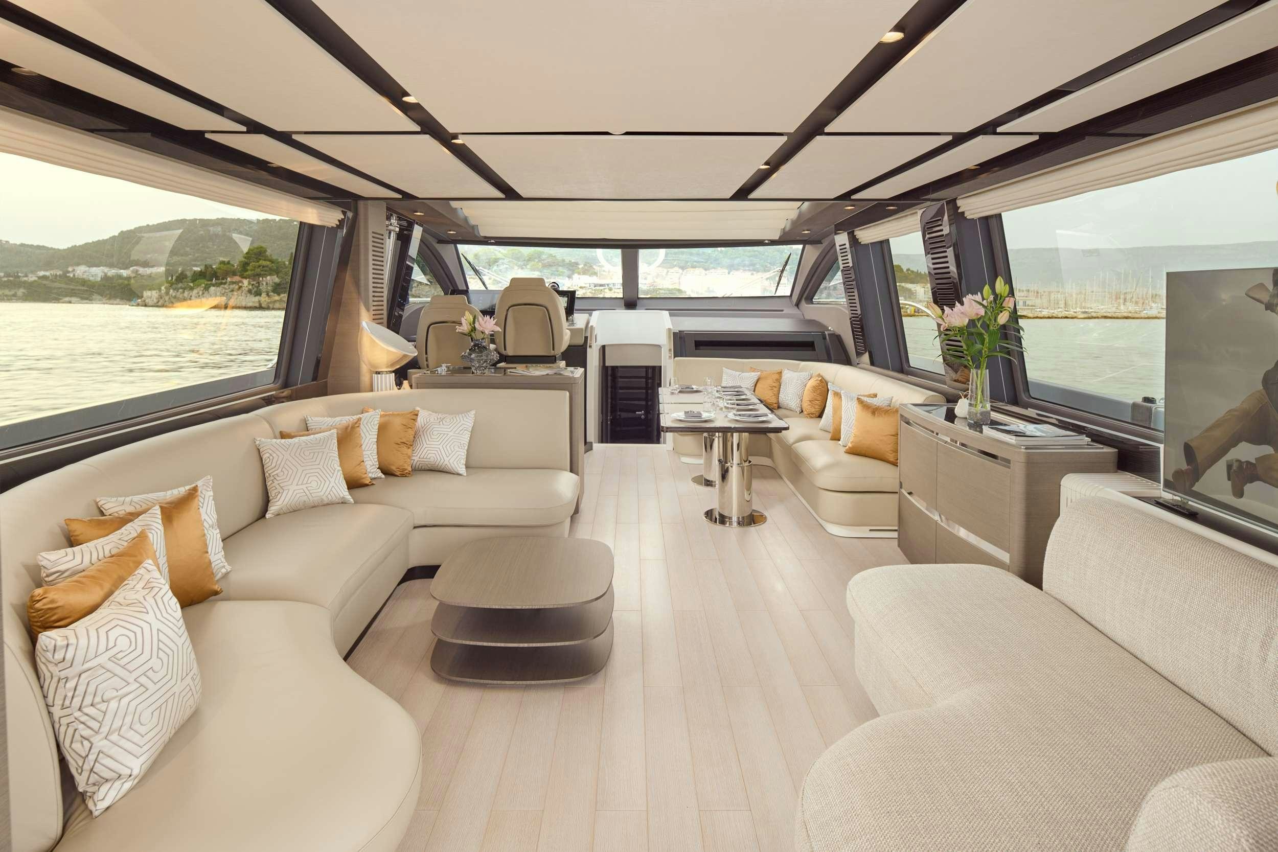 a living room with a large window aboard MYNE Yacht for Charter