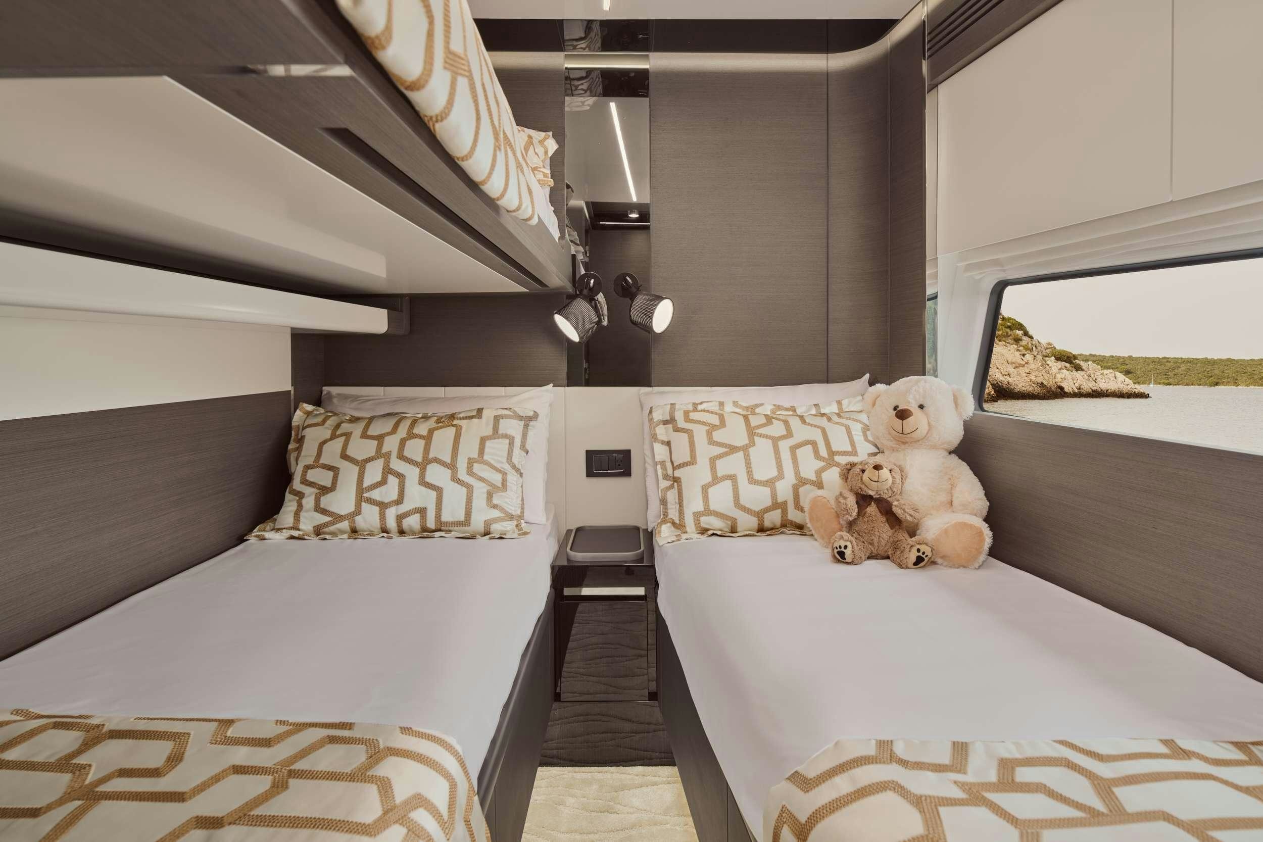 a couple of beds in a room aboard MYNE Yacht for Charter