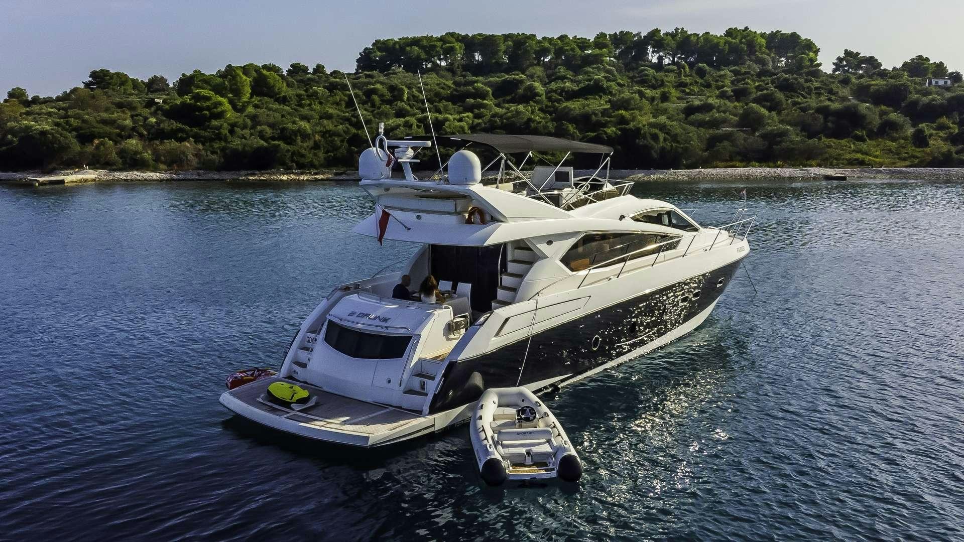 a boat on the water aboard 2 DRUNK Yacht for Charter