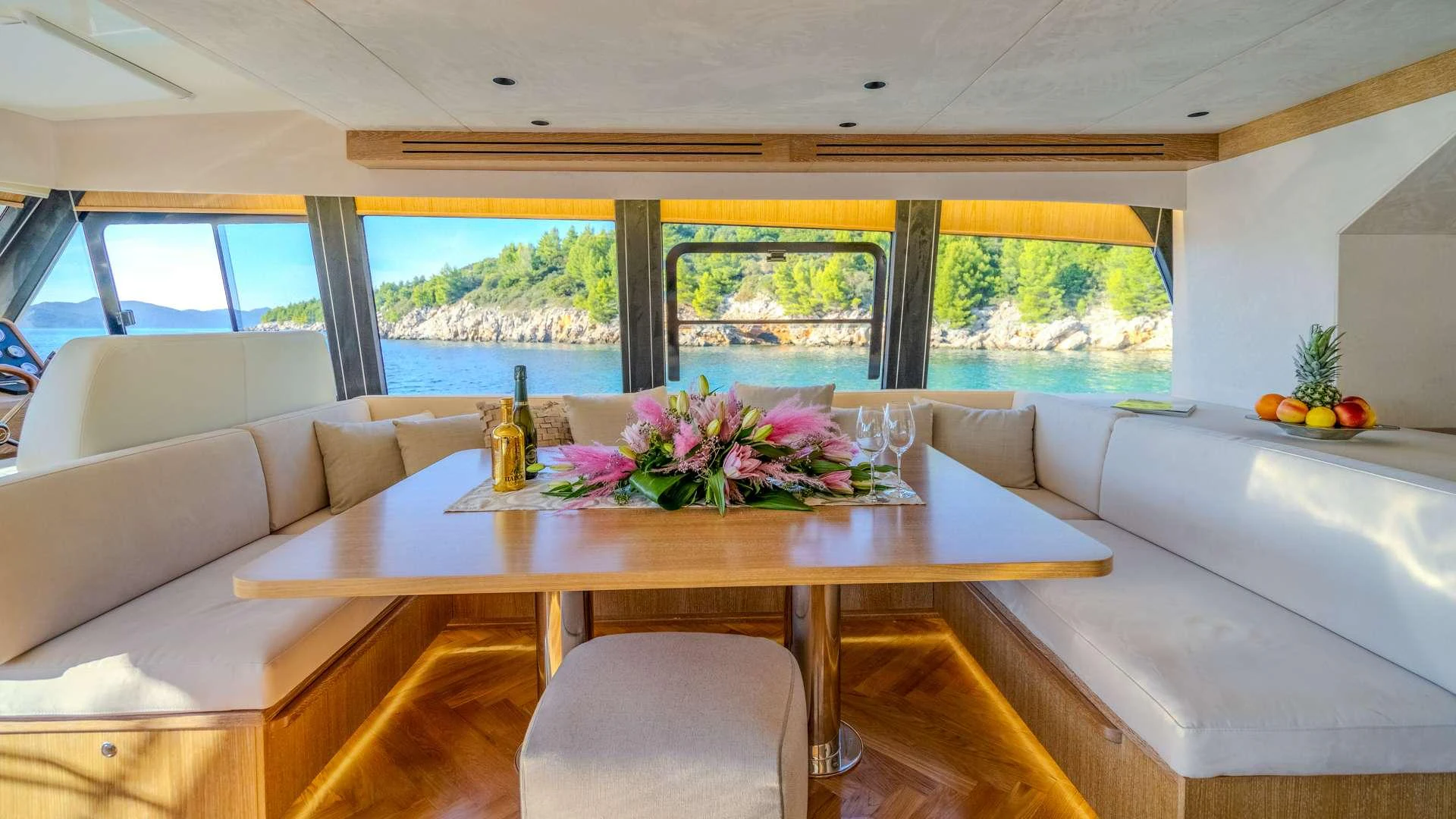 a large table with flowers on it aboard CLOUD 9 Yacht for Charter