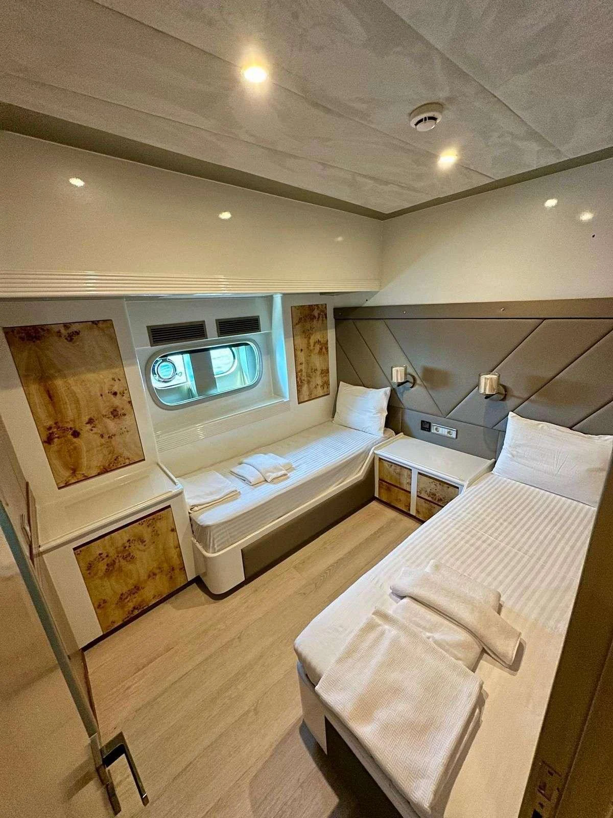 a bedroom with a bed and a television aboard ANGELO 3 Yacht for Charter