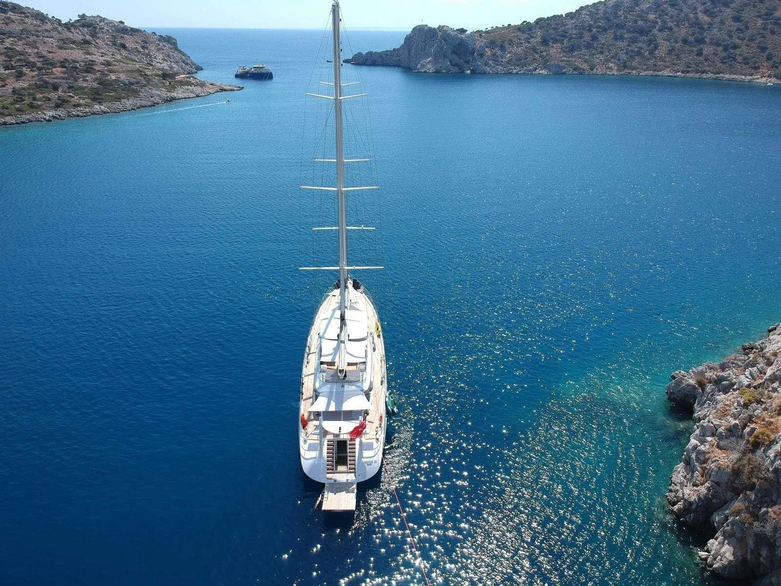 a boat sailing in the sea aboard ANGELO 3 Yacht for Charter