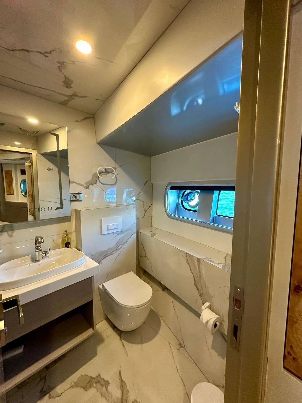 a bathroom with a large screen aboard ANGELO 3 Yacht for Charter