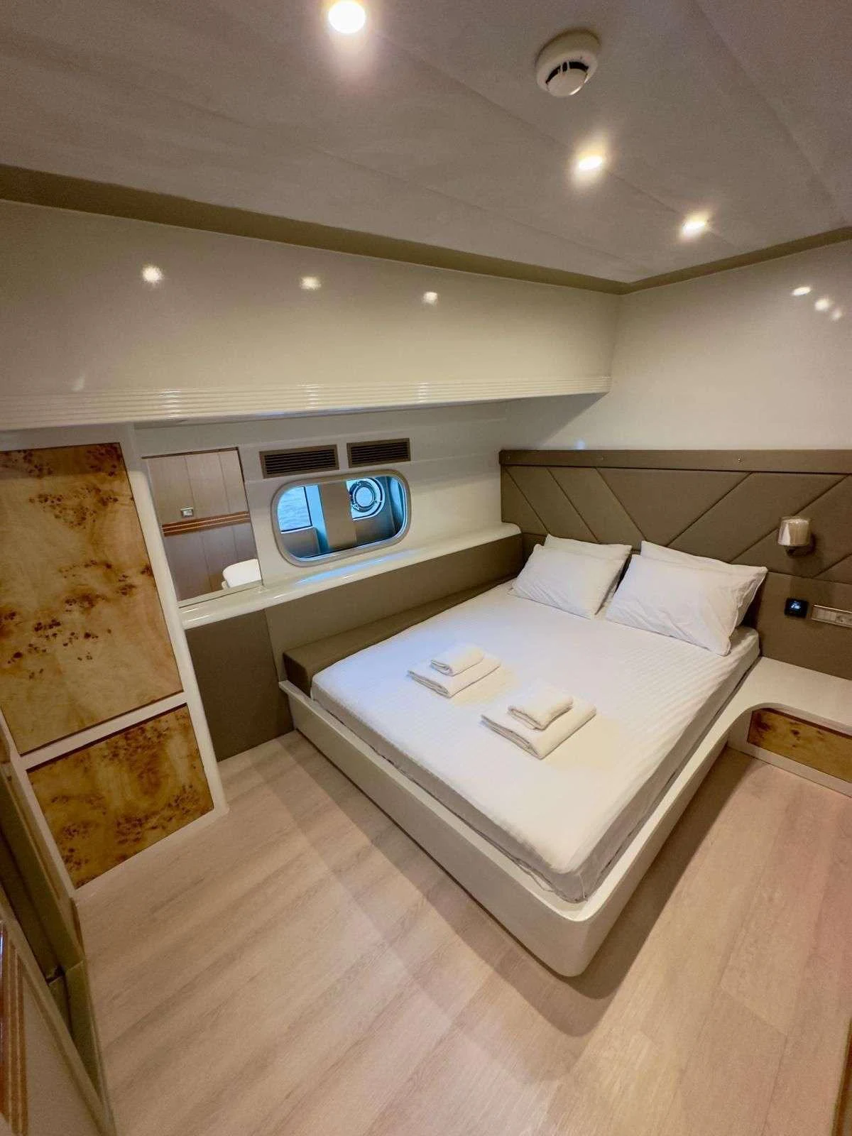 a bedroom with a bed and a television aboard ANGELO 3 Yacht for Charter