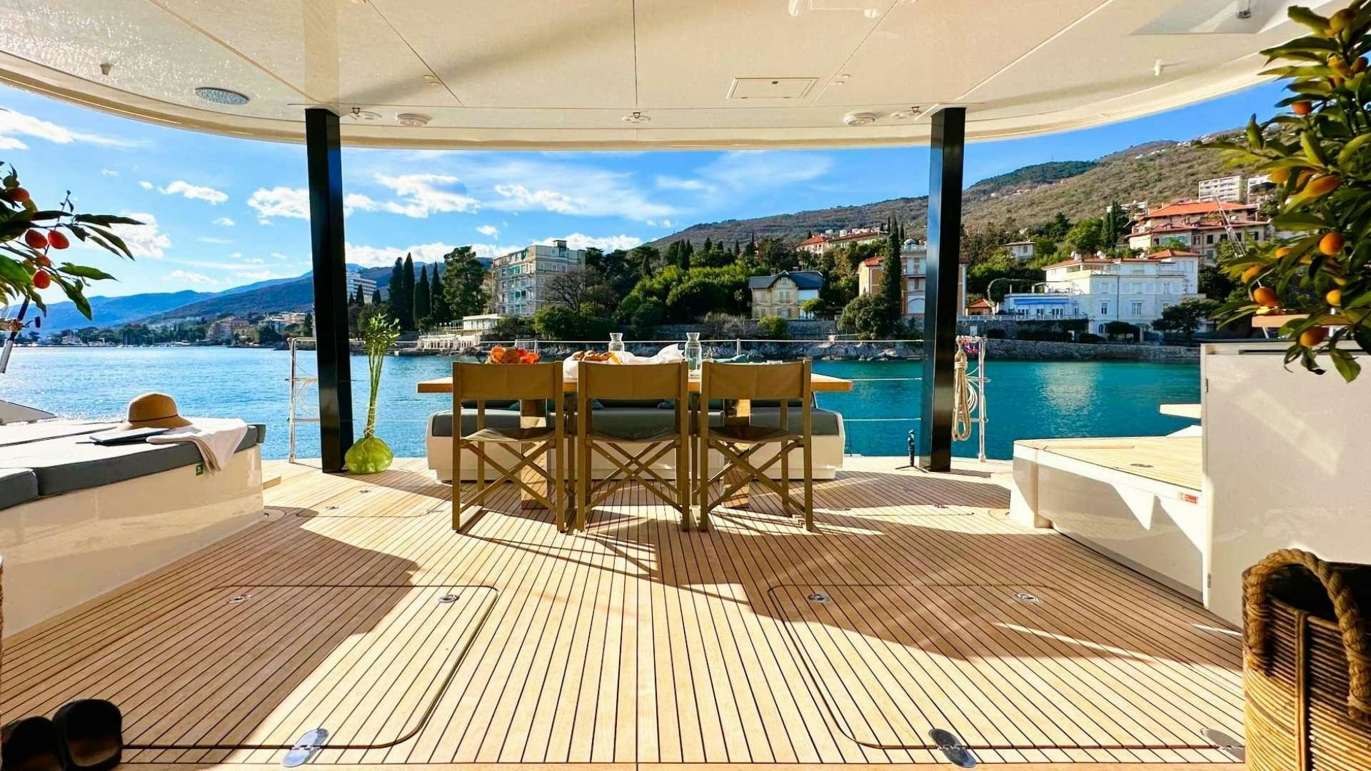 a room with a table and chairs aboard HONEYBIRD Yacht for Charter