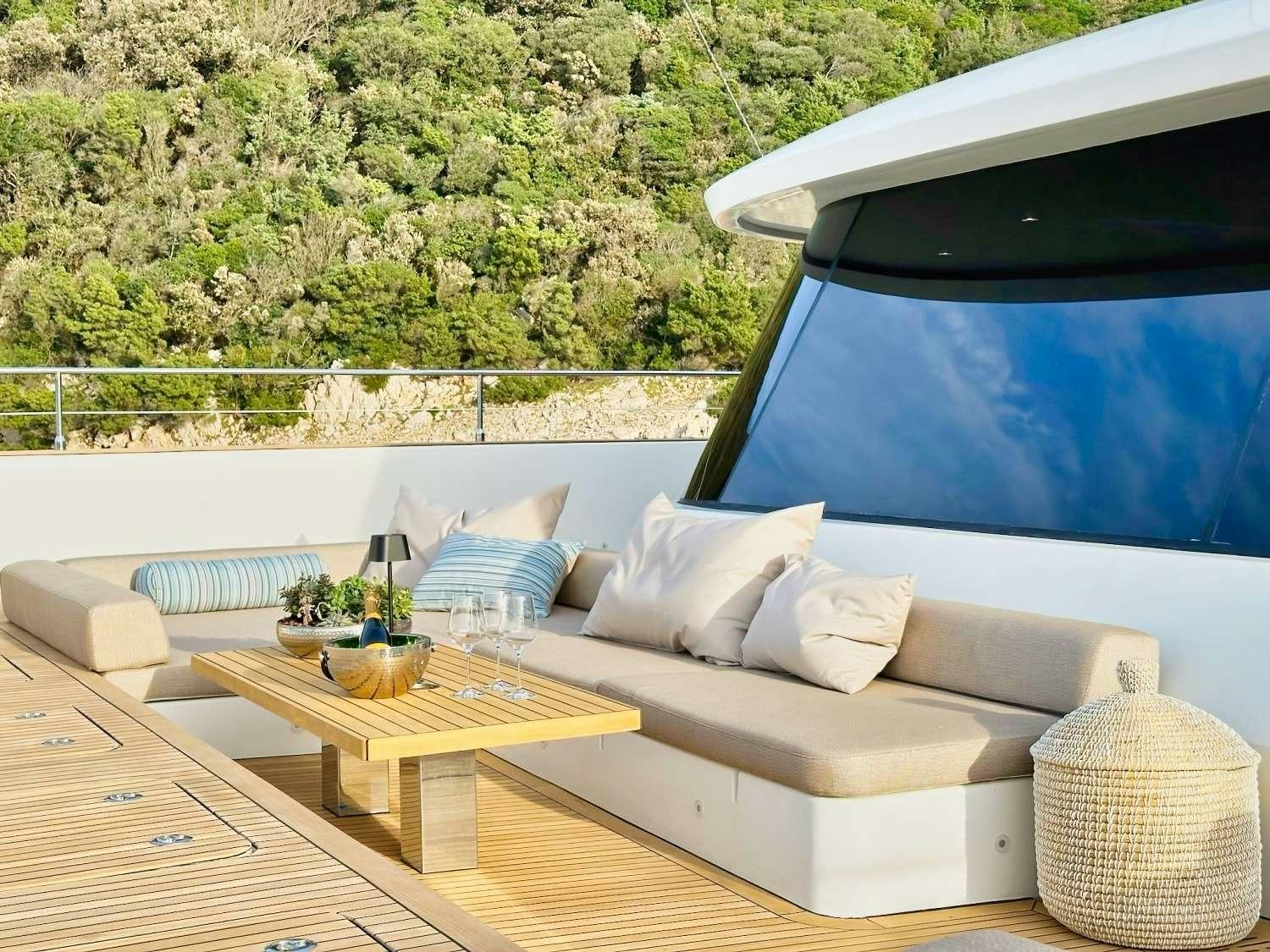 a room with a couch and a pool aboard HONEYBIRD Yacht for Charter