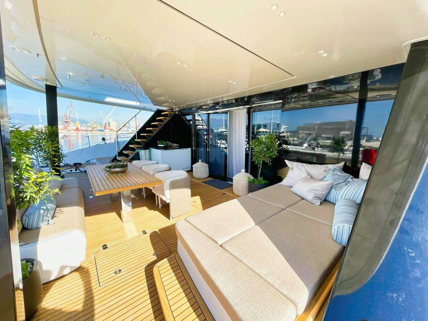 a room with a large window and a view of the ocean aboard HONEYBIRD Yacht for Charter