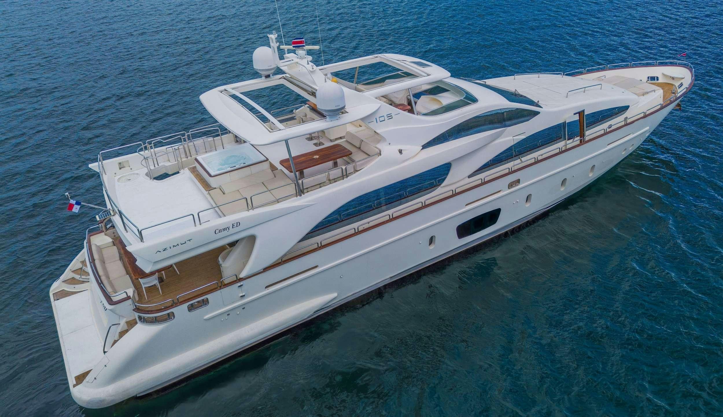 a white boat on the water aboard CAMY ED Yacht for Charter