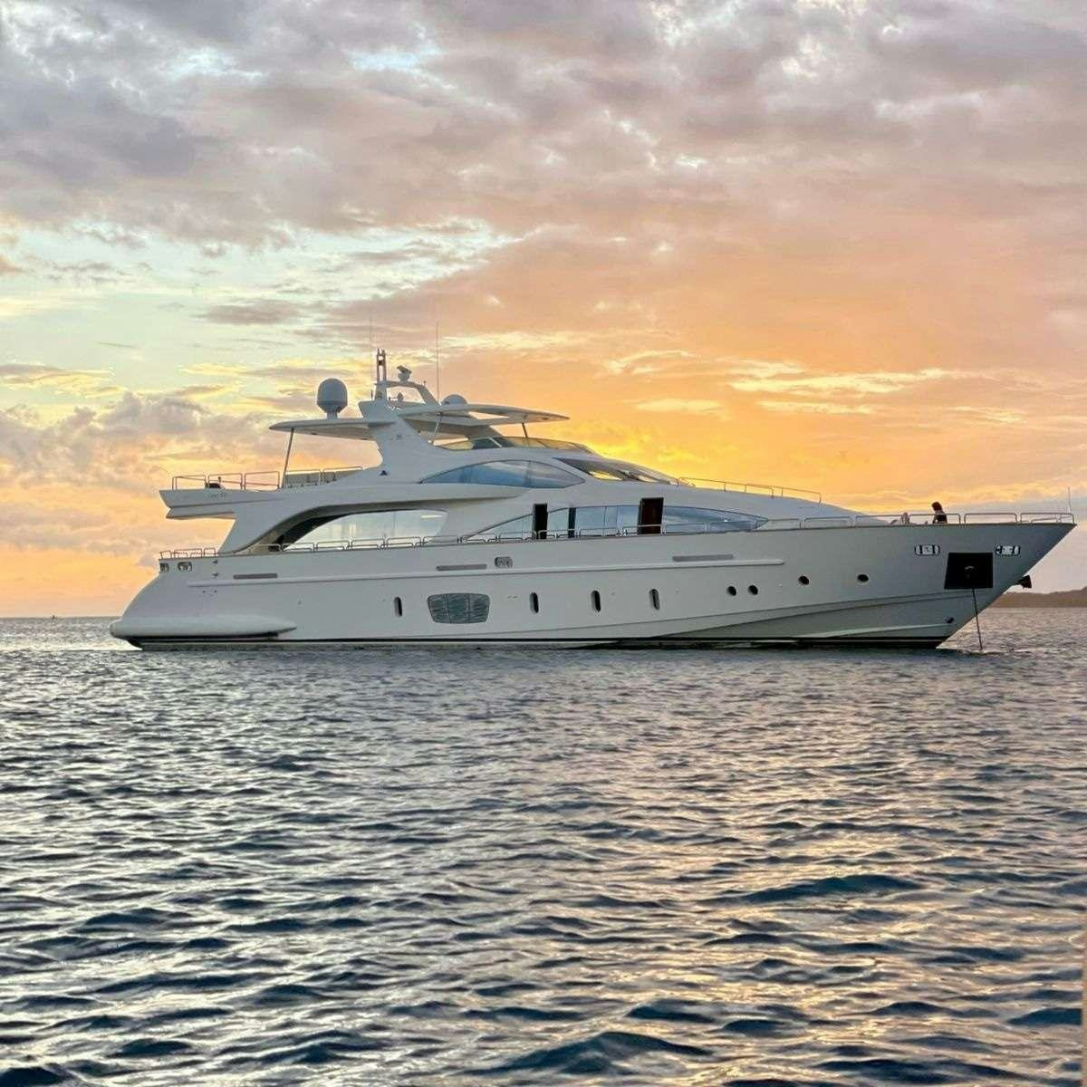a large white yacht in the water aboard CAMY ED Yacht for Charter