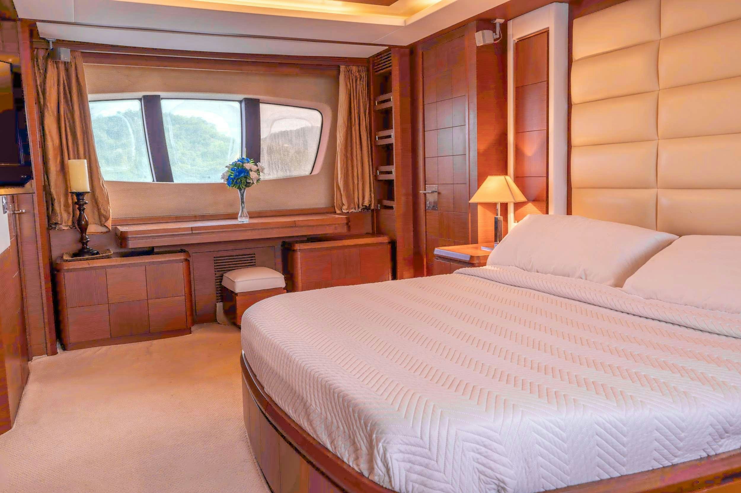 a room with a bed and a desk aboard CAMY ED Yacht for Charter