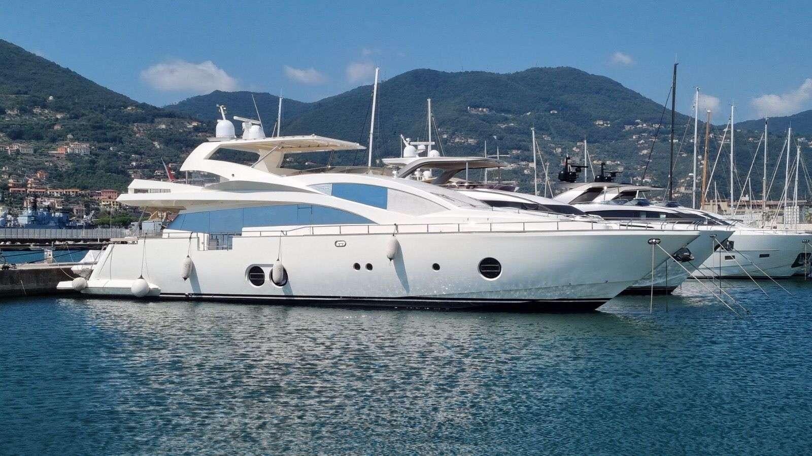 a white yacht in the water aboard RED ROSE Yacht for Charter