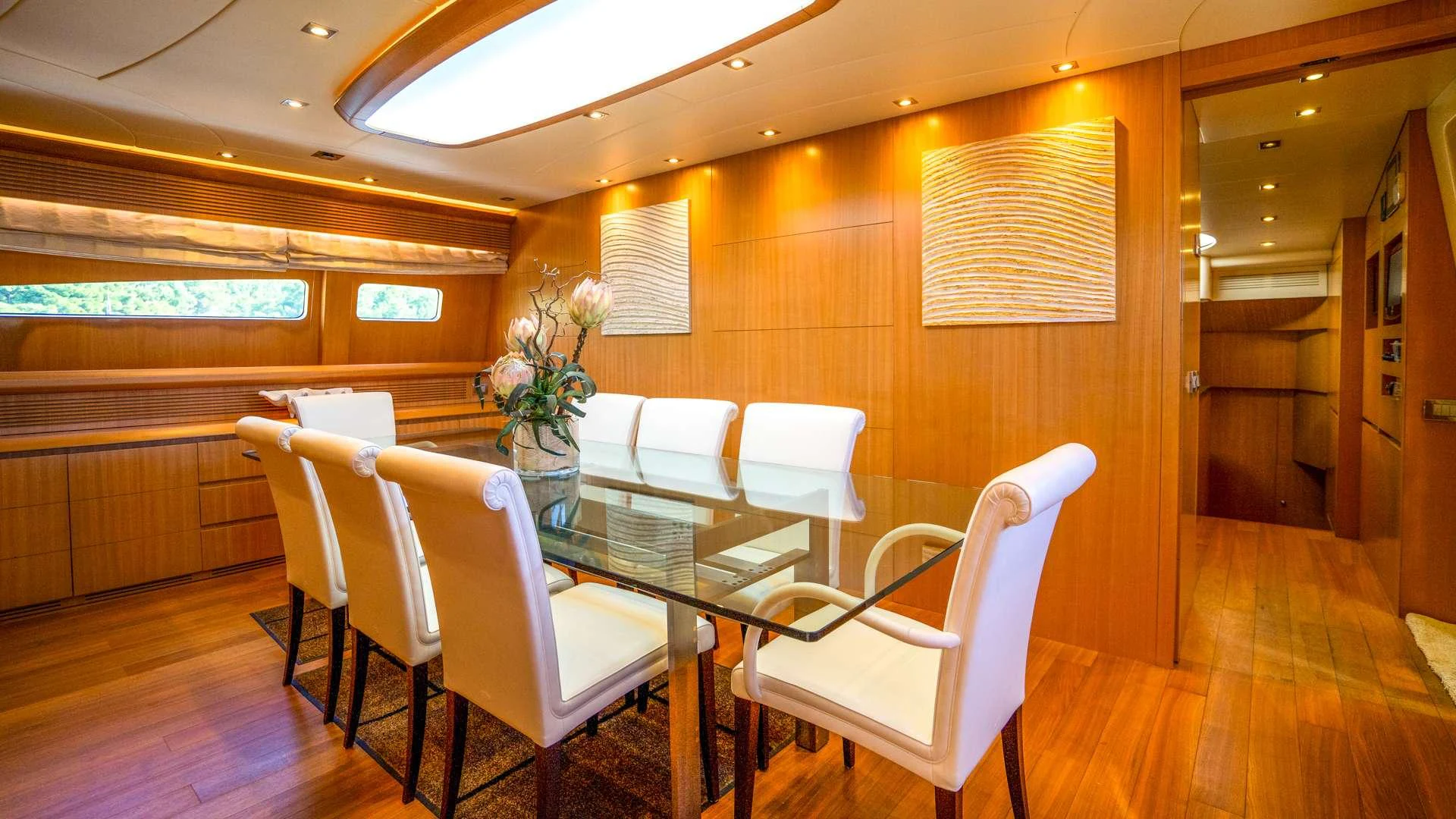 a room with a table and chairs aboard CYNTHIA Yacht for Charter