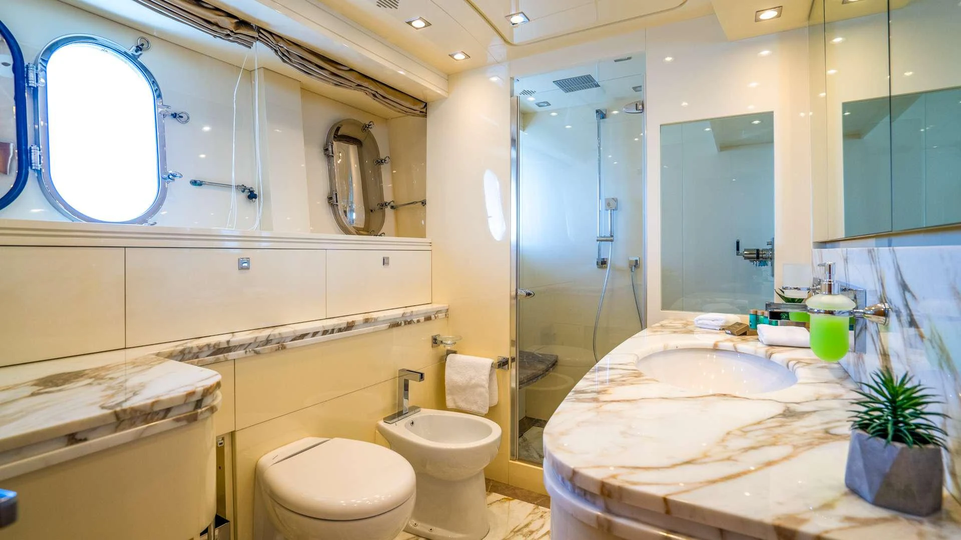 a bathroom with a large mirror aboard CYNTHIA Yacht for Charter