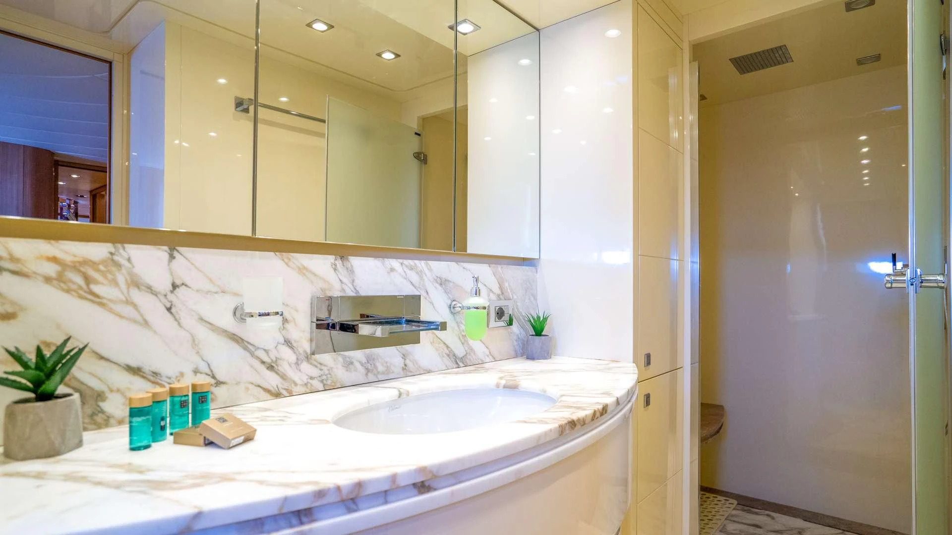 a bathroom with a large mirror aboard CYNTHIA Yacht for Charter