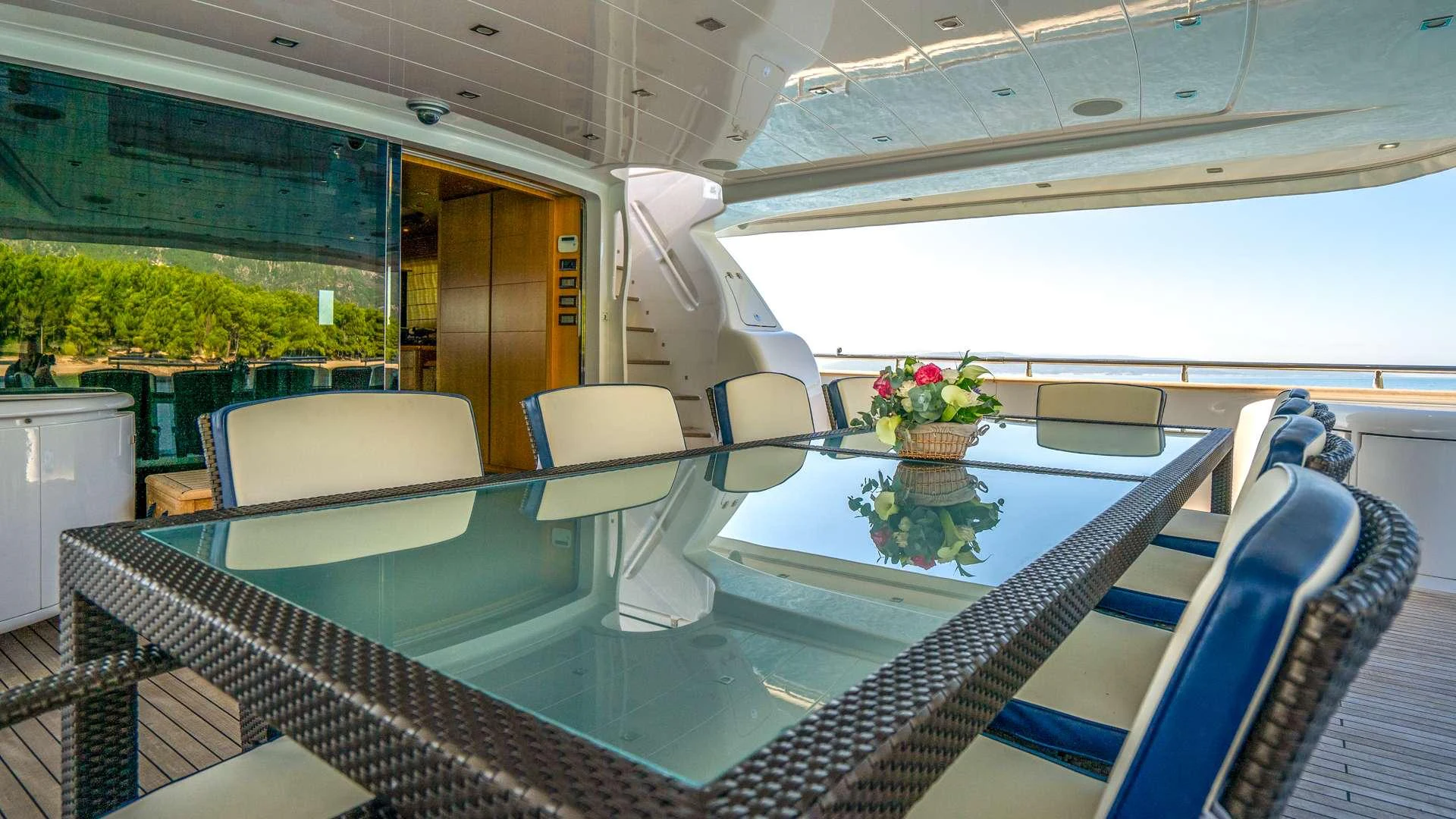 a pool with a table and chairs aboard CYNTHIA Yacht for Charter