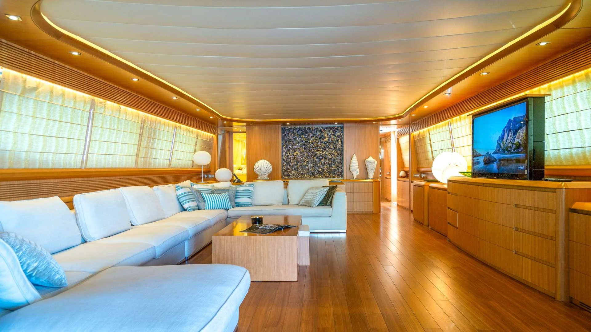 a living room with a large window aboard CYNTHIA Yacht for Charter