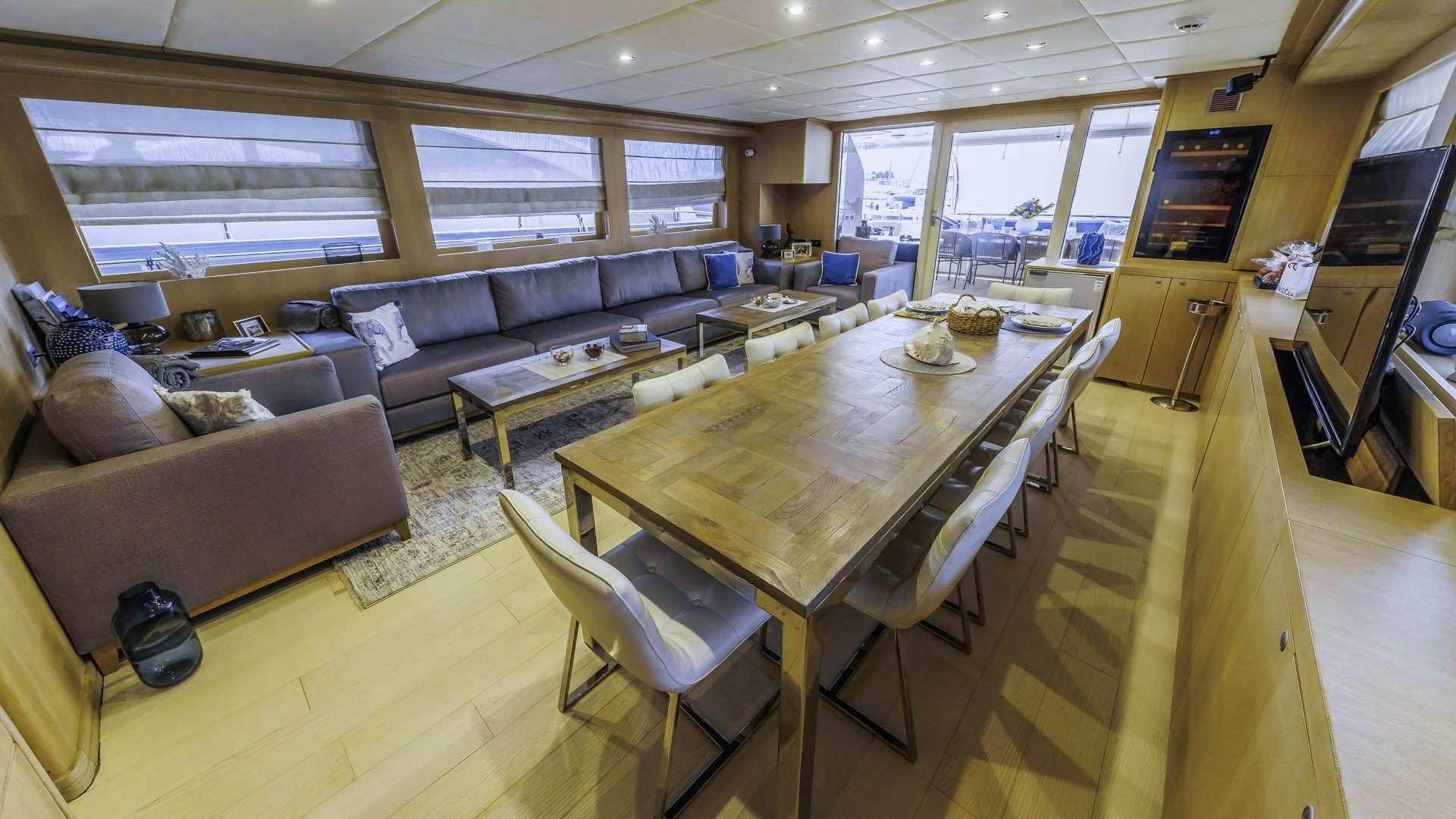 a living room with a couch and a coffee table aboard GRACE Yacht for Charter