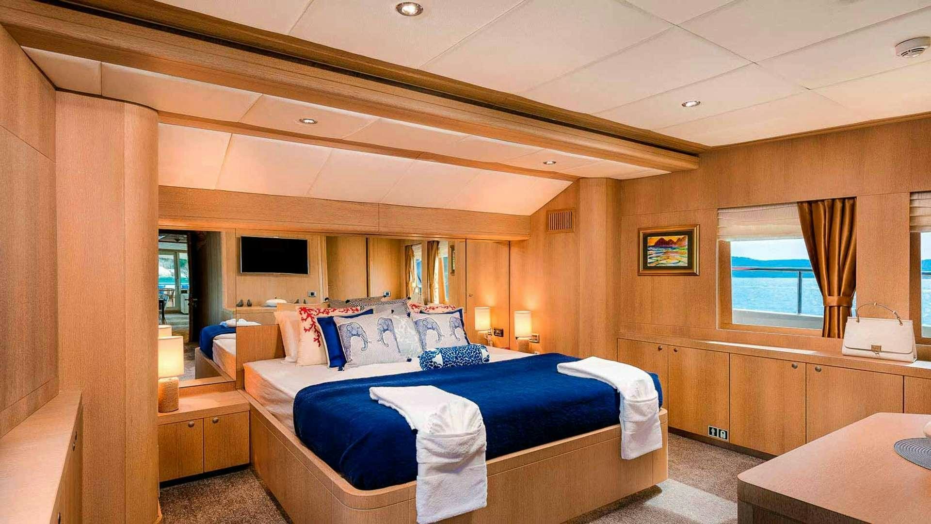 a room with two beds aboard GRACE Yacht for Charter