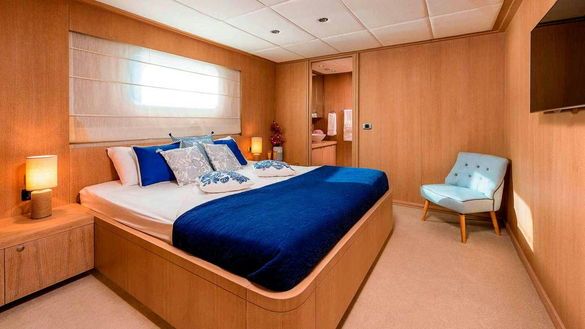 a bed in a room aboard GRACE Yacht for Charter