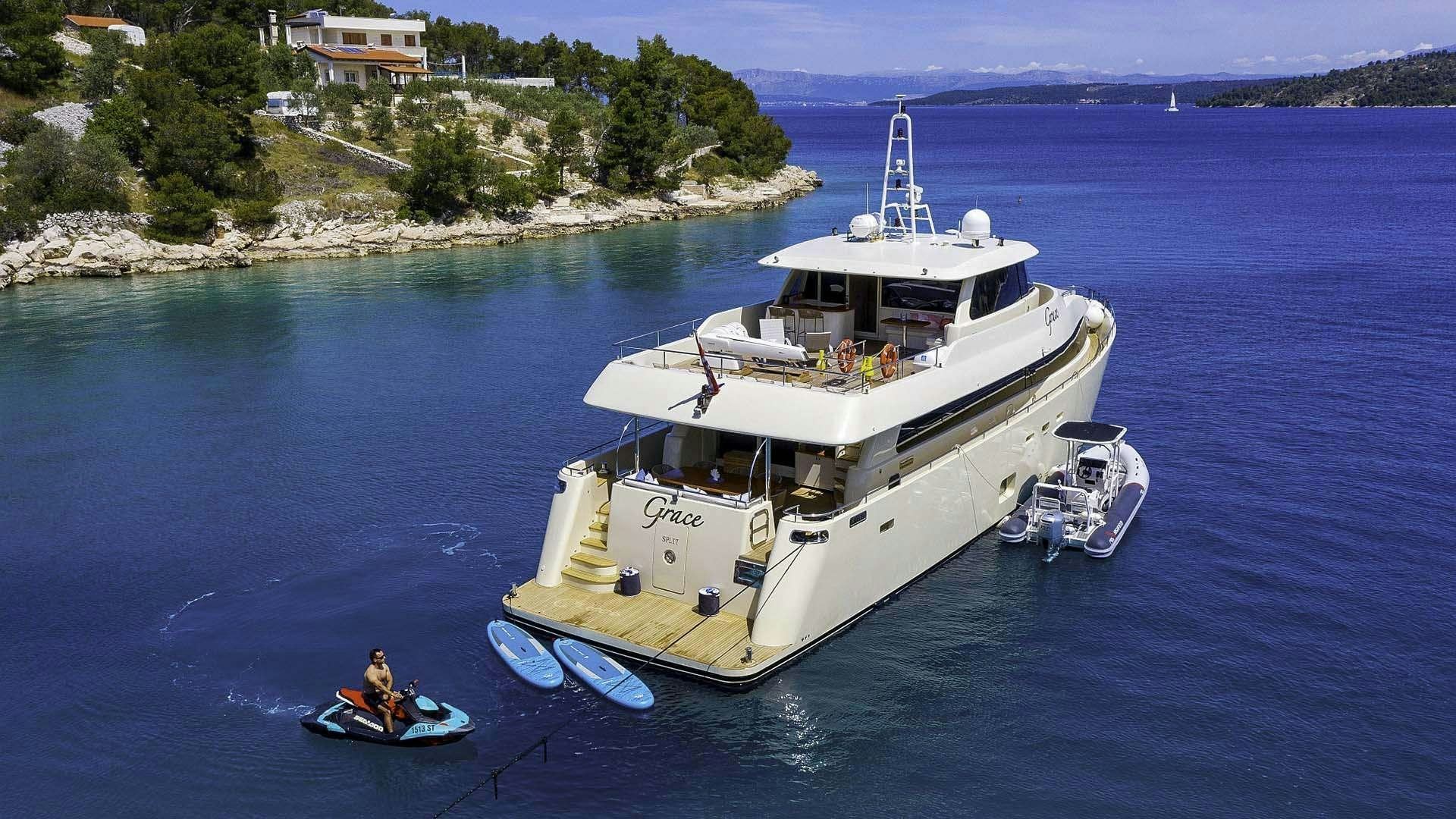 a large ship in the water aboard GRACE Yacht for Charter