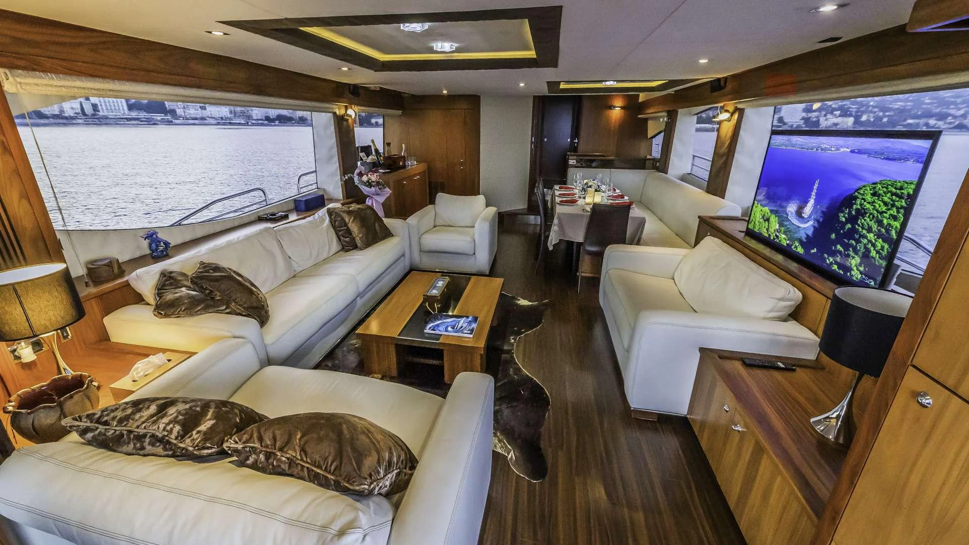 a living room with a large screen aboard THE BEST WAY Yacht for Charter