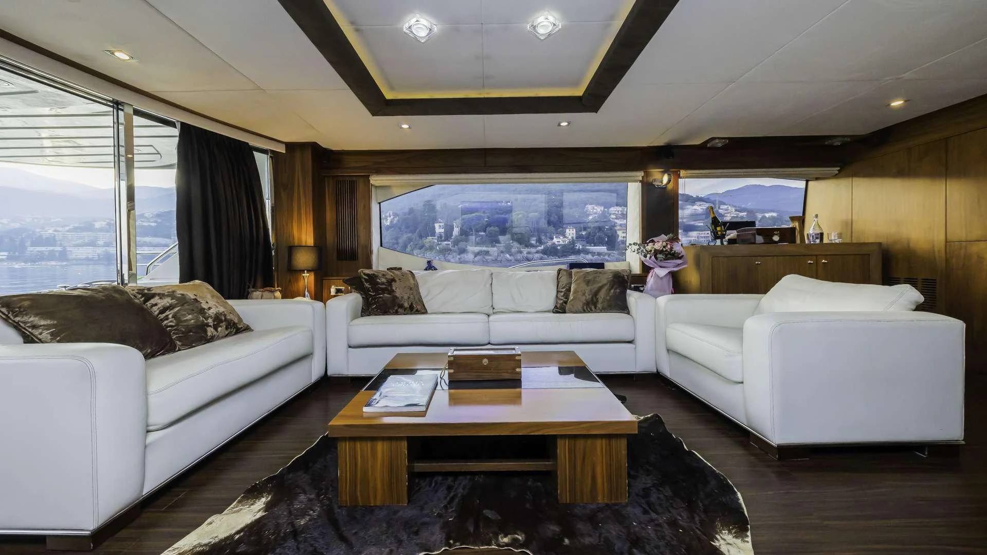 a living room with a large window aboard THE BEST WAY Yacht for Charter