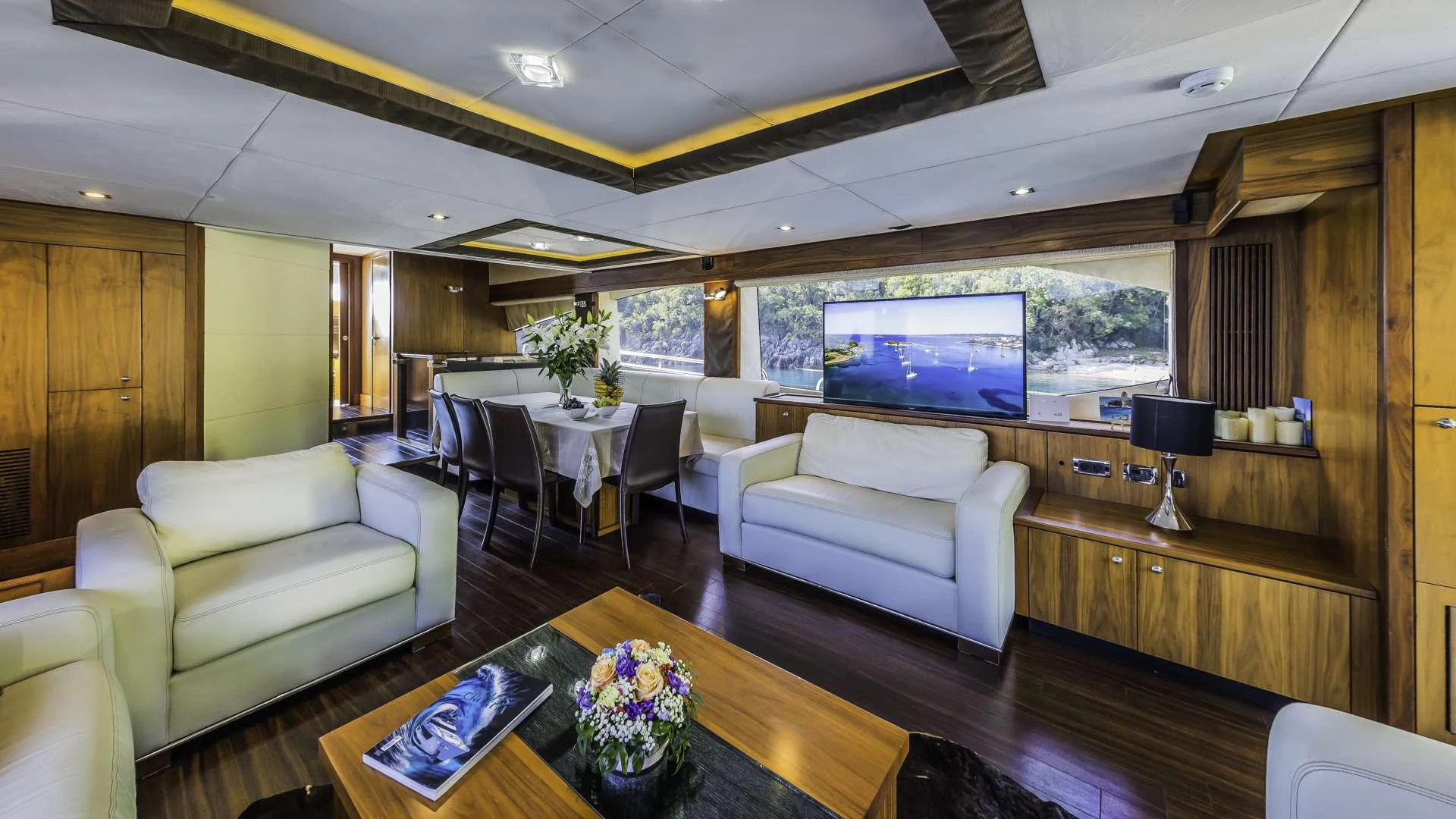 a living room with a large window aboard THE BEST WAY Yacht for Charter