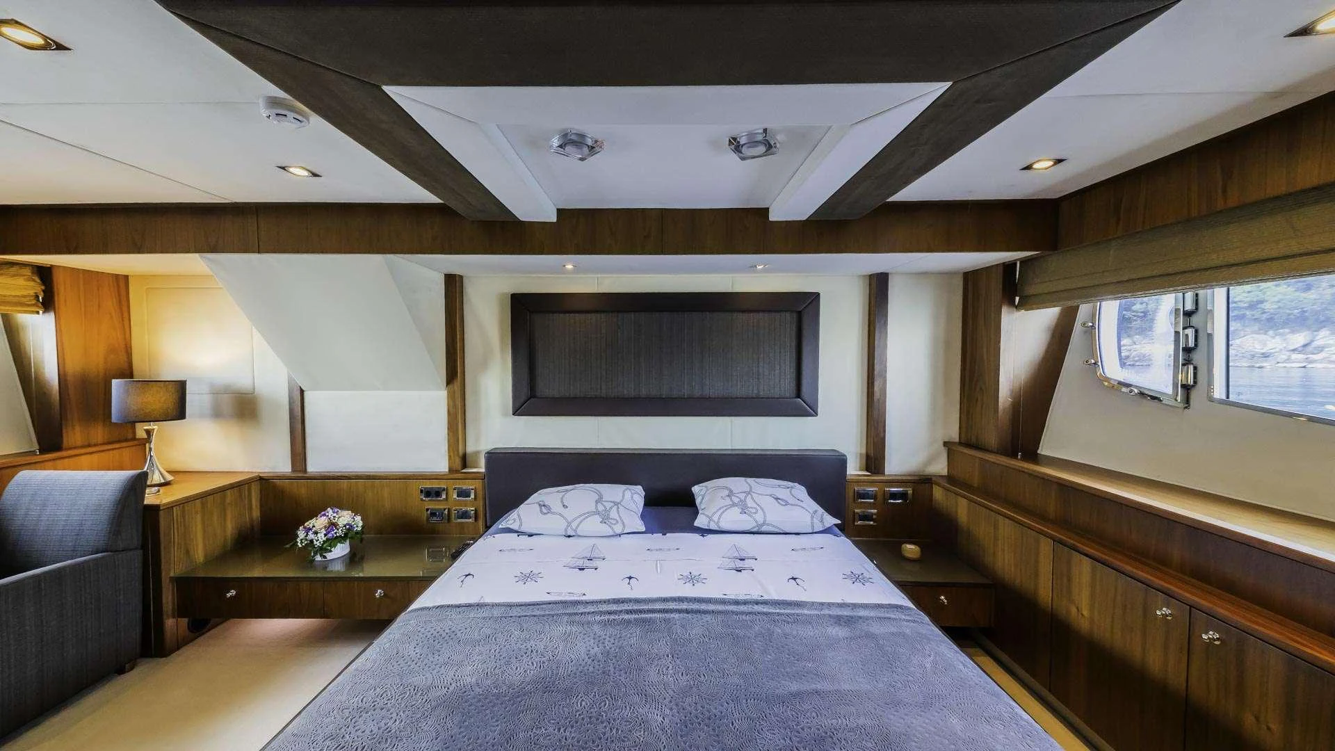 a bedroom with a bed and a couch aboard THE BEST WAY Yacht for Charter