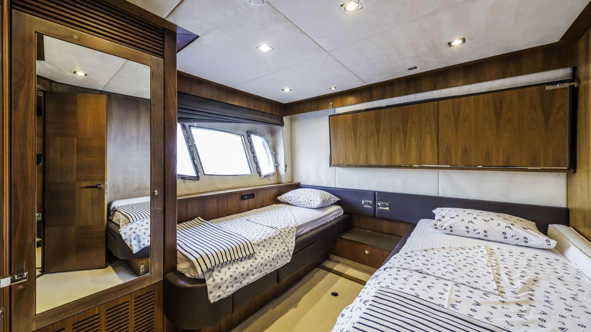 a couple of beds in a room aboard THE BEST WAY Yacht for Charter
