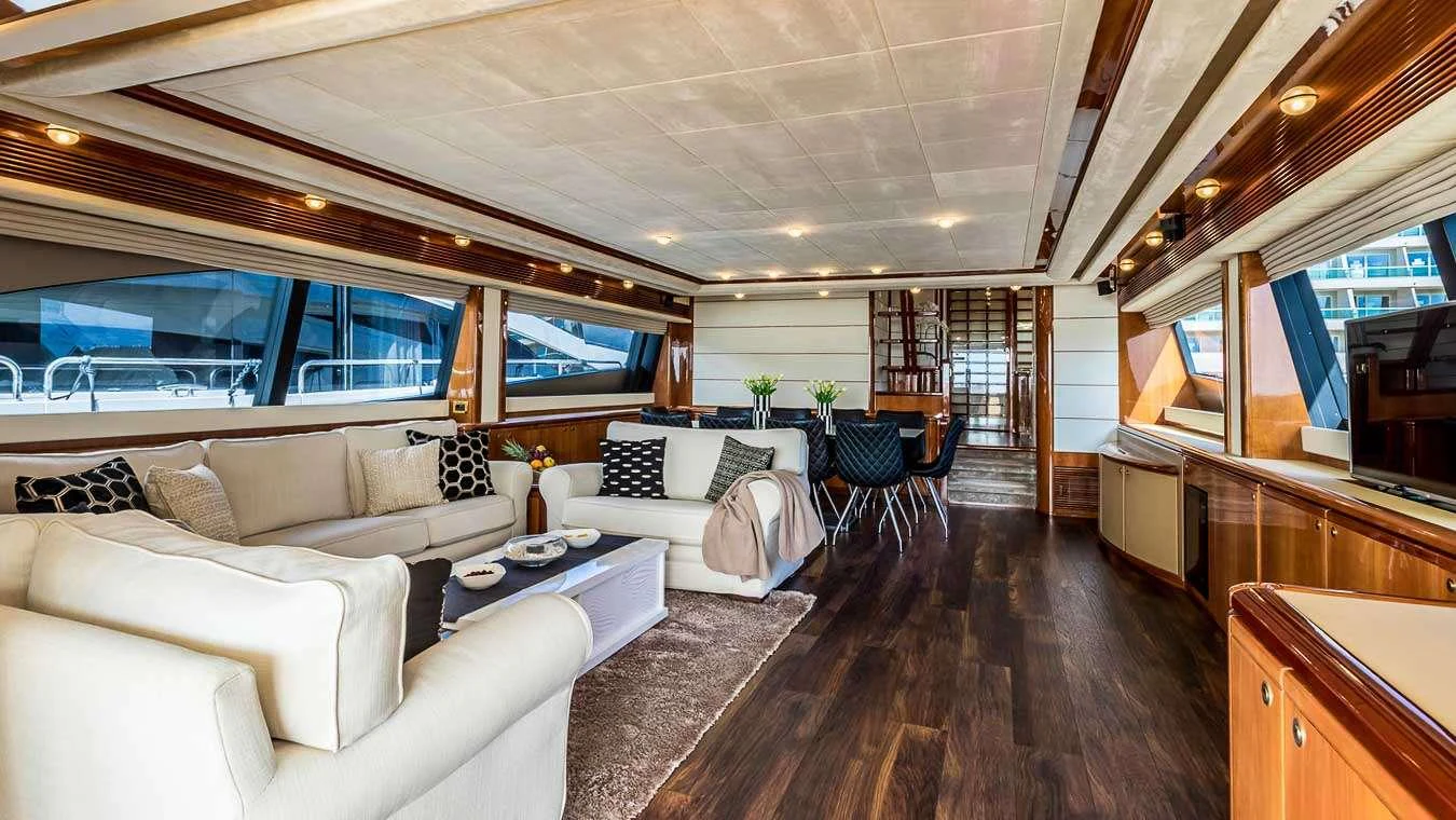 a living room with a large window aboard KATARIINA Yacht for Charter
