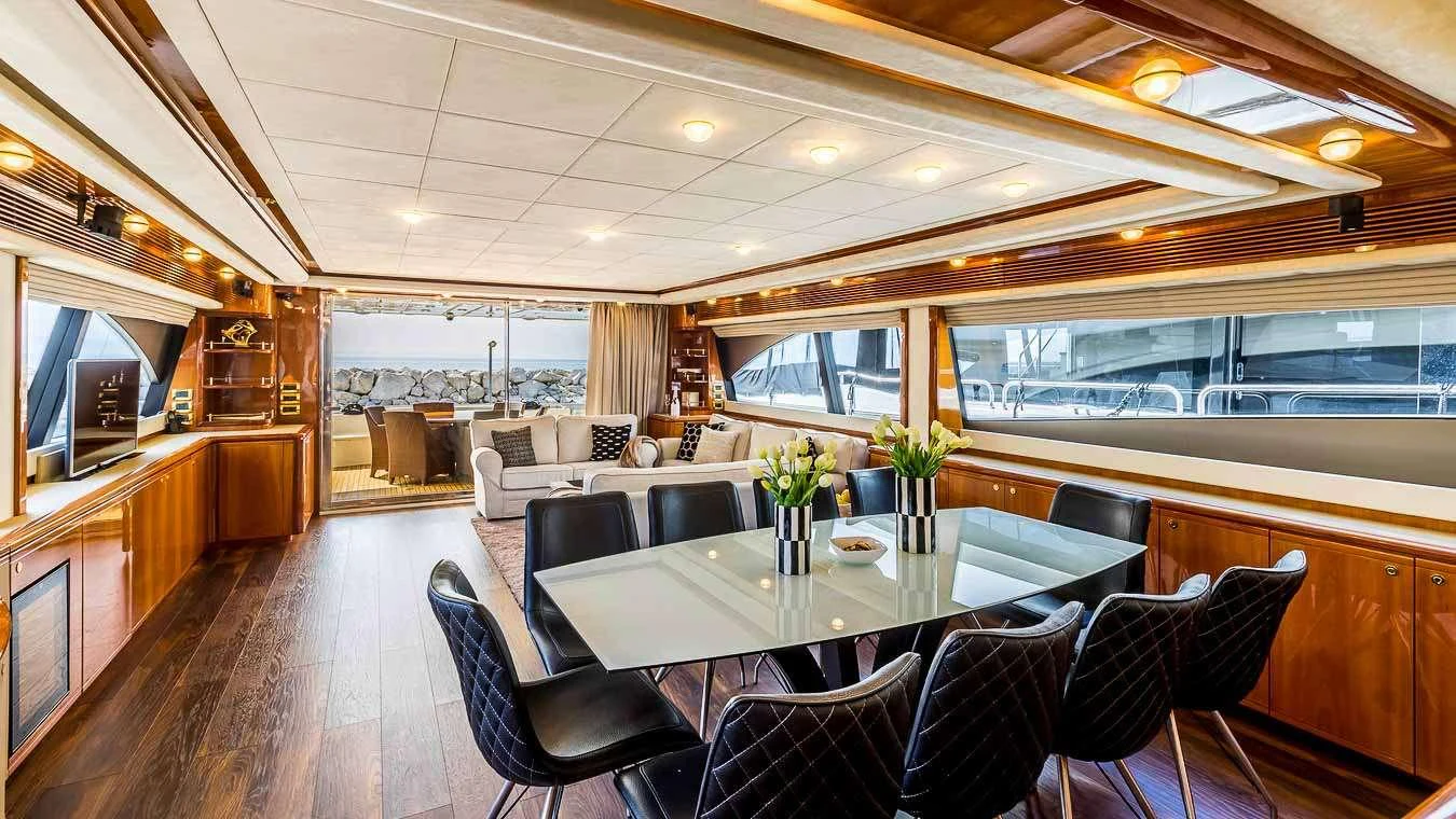 a large room with a table and chairs aboard KATARIINA Yacht for Charter