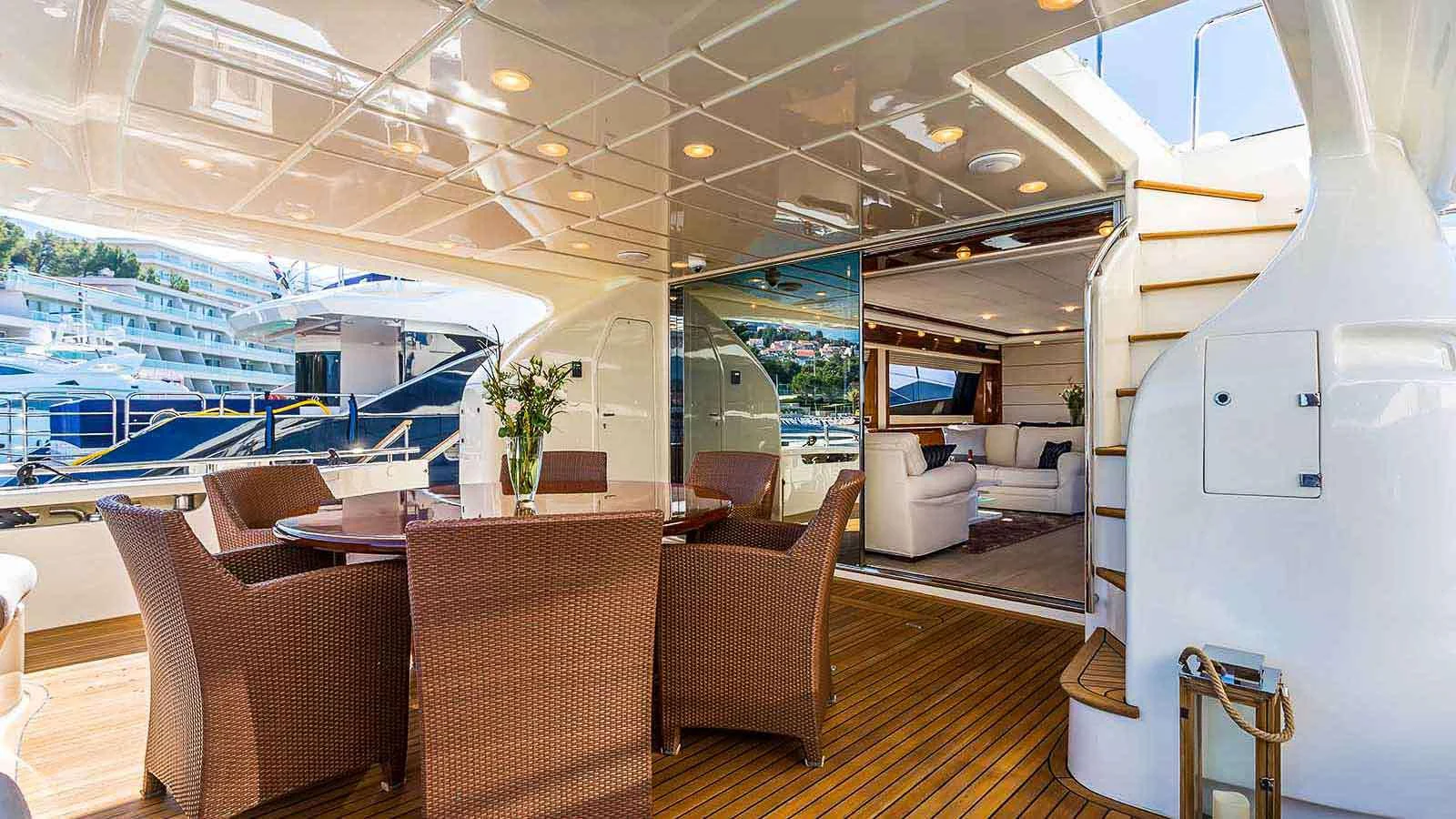 a room with a table chairs and a television aboard KATARIINA Yacht for Charter