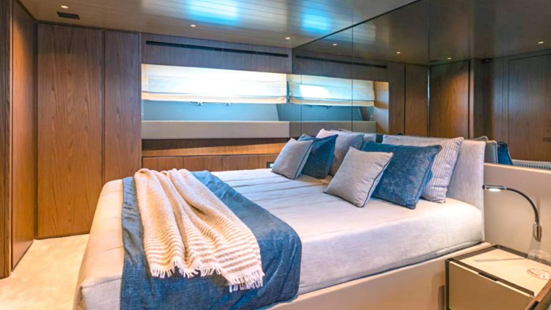 a bed with pillows aboard KIMANI Yacht for Charter