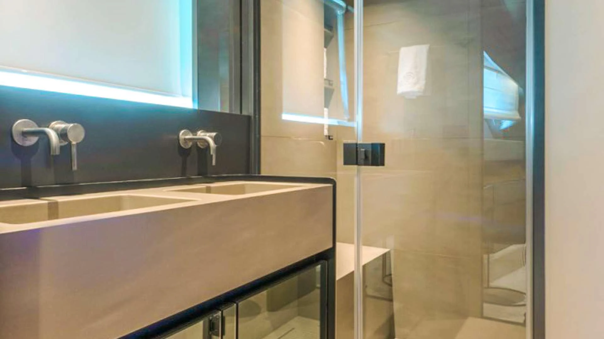 a bathroom with a glass shower aboard KIMANI Yacht for Charter