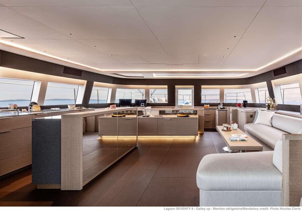 a room with a couch and a table aboard JAN'S FELINE Yacht for Charter