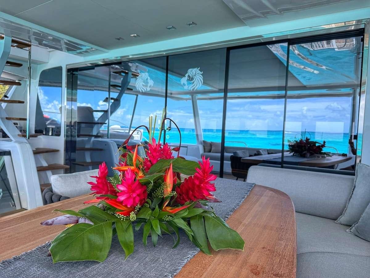 a room with a table and chairs aboard JAN'S FELINE Yacht for Charter