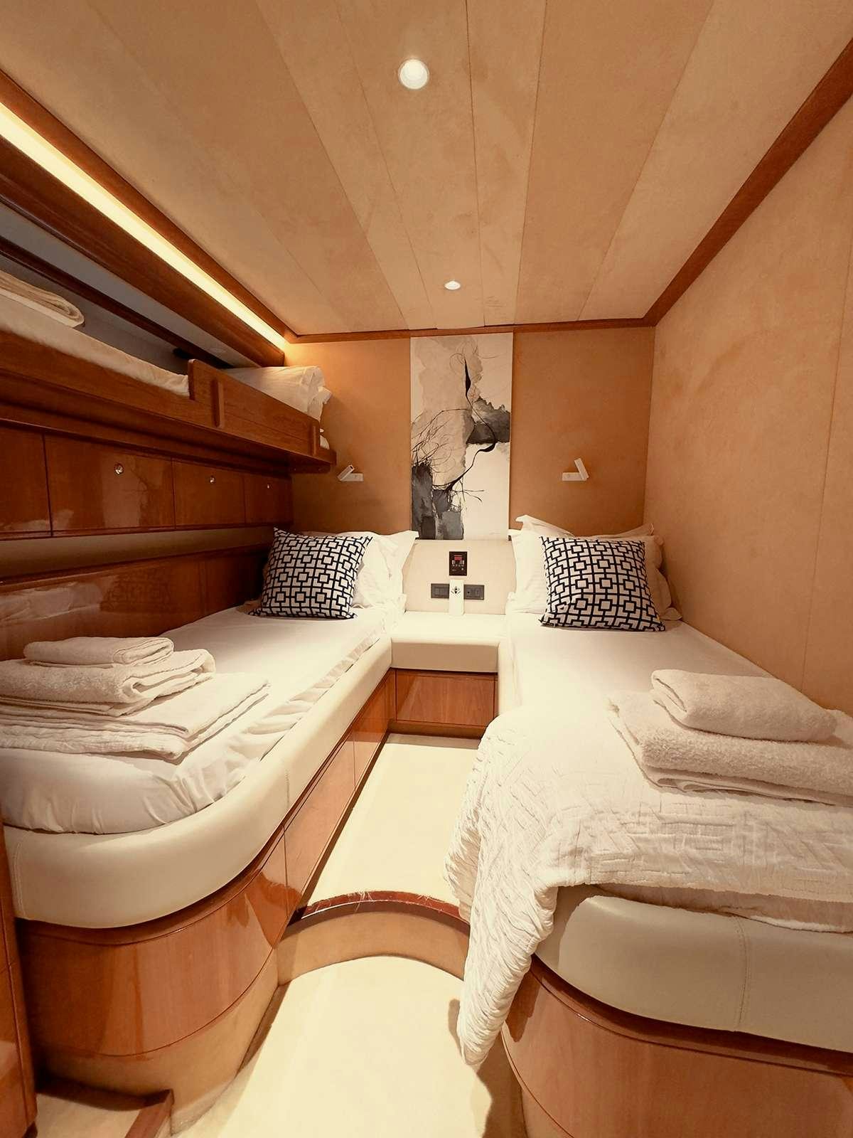 a room with two beds aboard ARCELIA Yacht for Charter