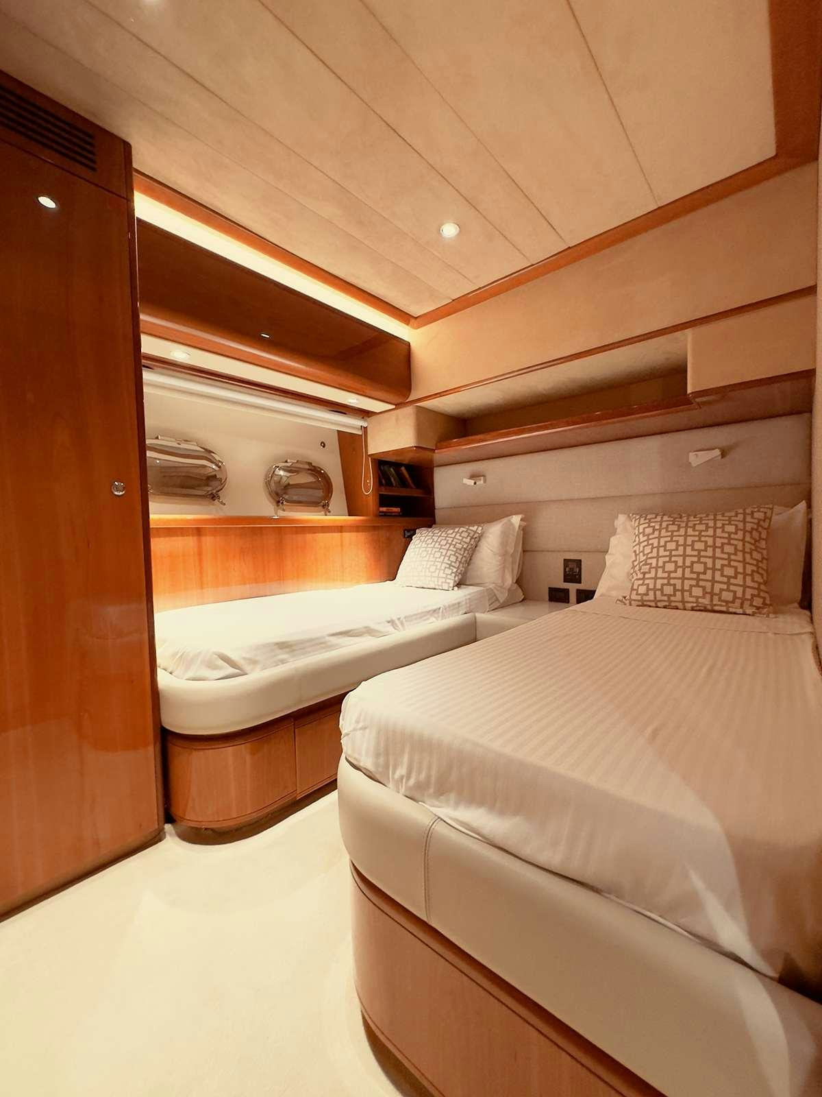 a room with two beds aboard ARCELIA Yacht for Charter