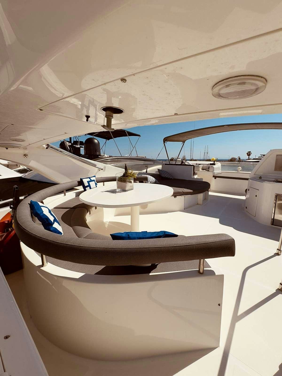 a white table with a blue and white design on it aboard ARCELIA Yacht for Charter