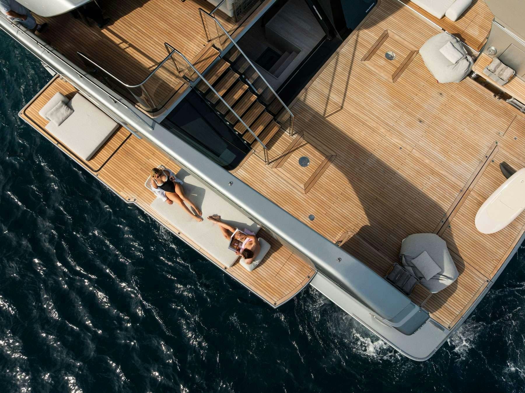 a group of people in a room aboard SENSA Yacht for Charter